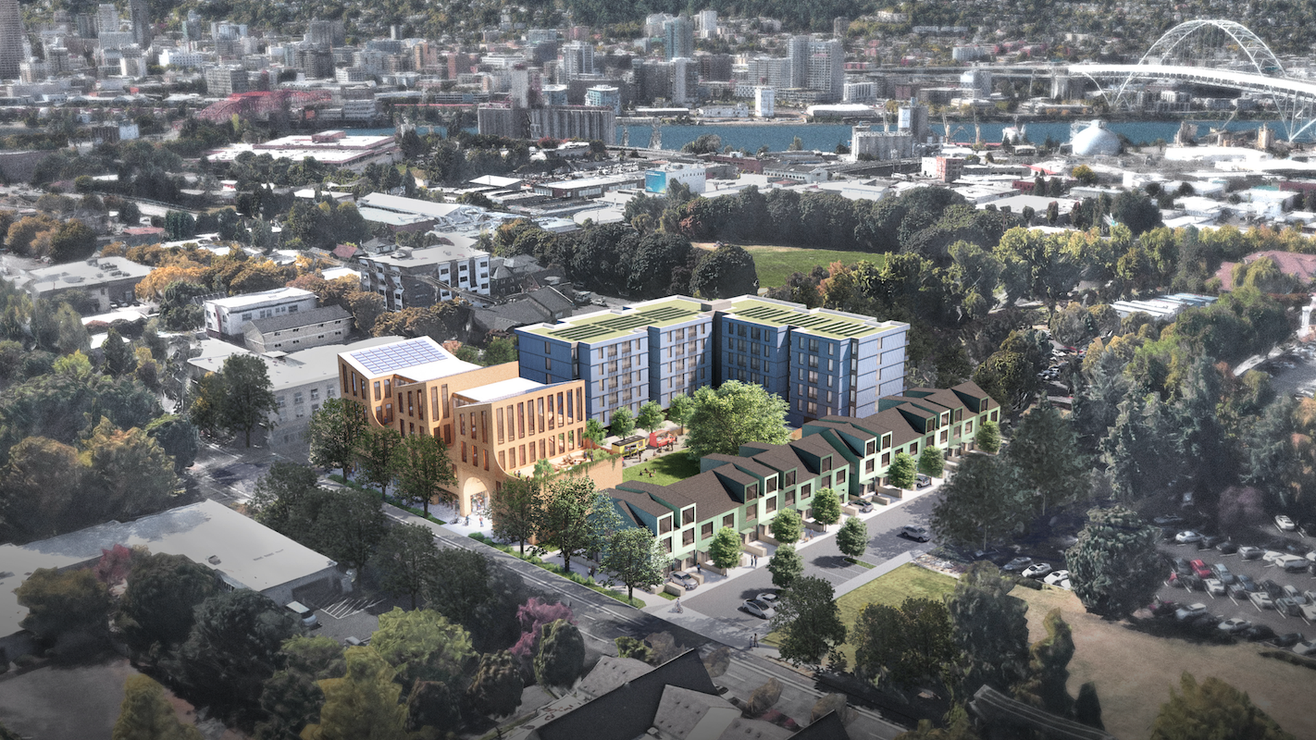An artists rendering shows a development in North Portland featuring townhomes, apartments and a courtyard.