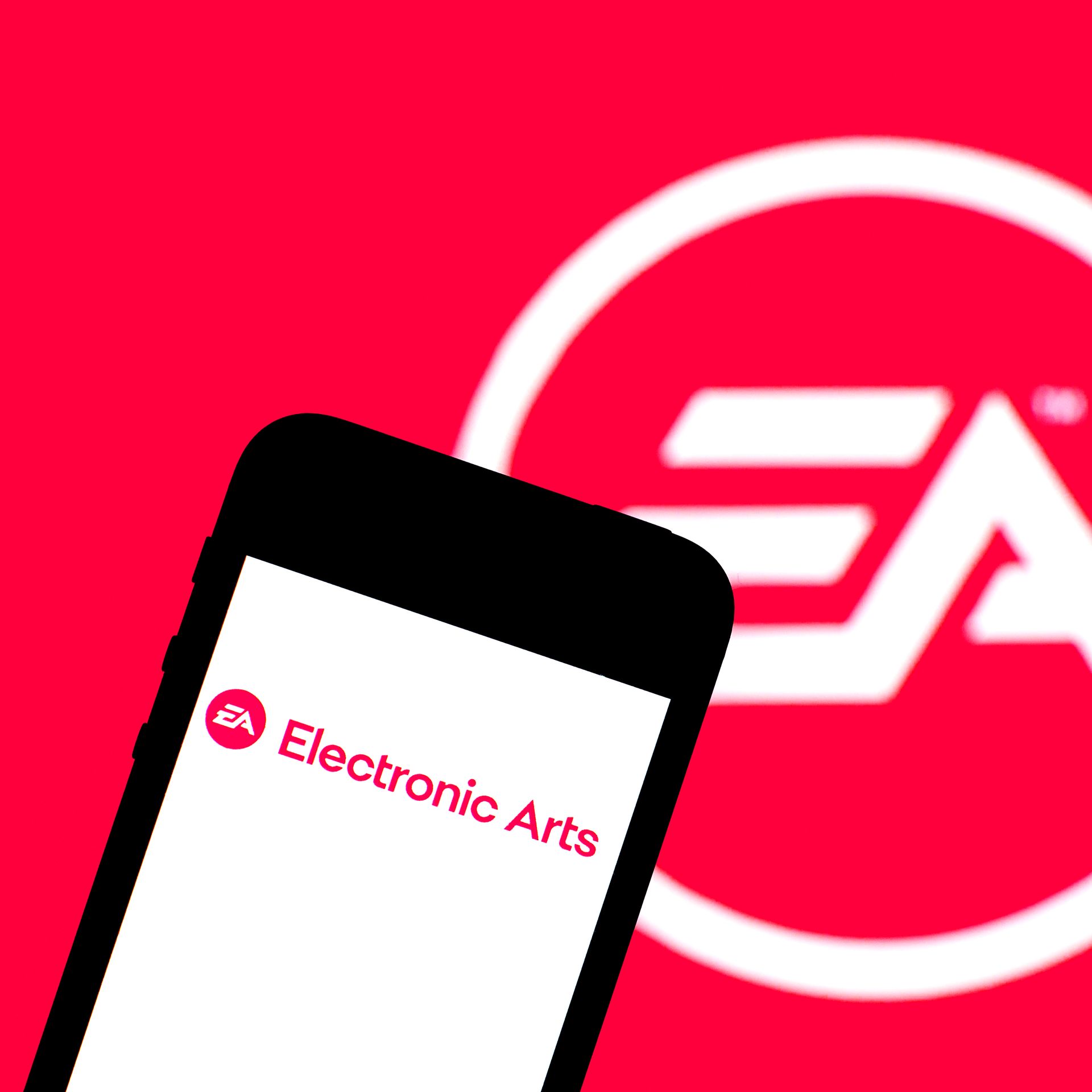 Photo of a cell phone and the logo for Electronic Arts