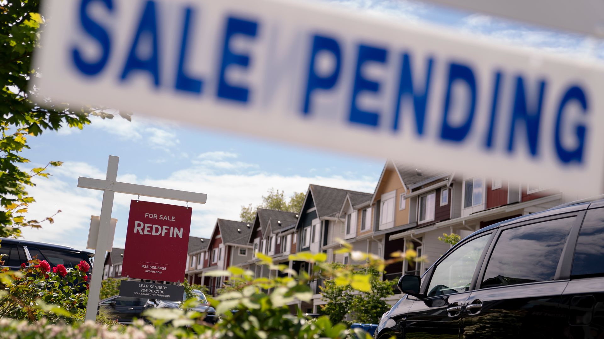 Sign of sale pending in front of homes