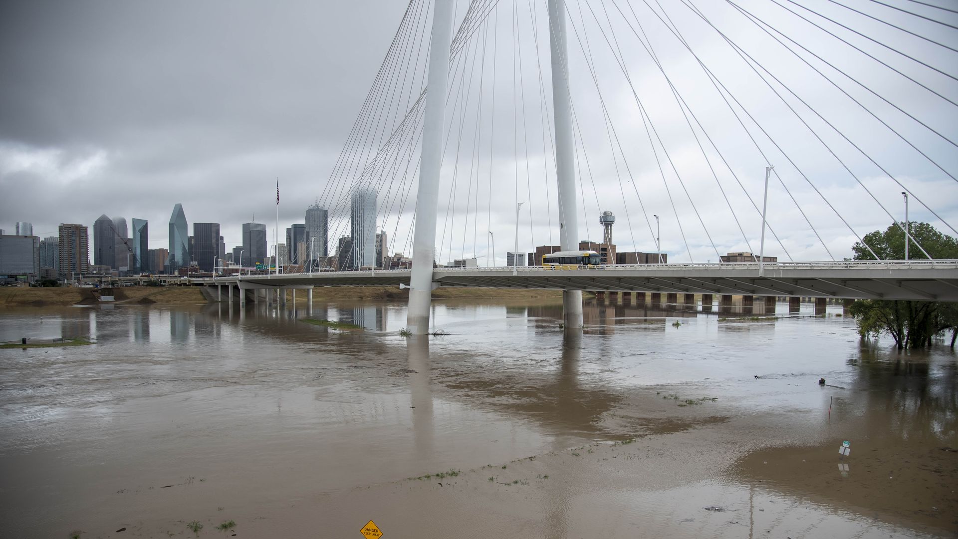 The Trinity River, brown and cresting