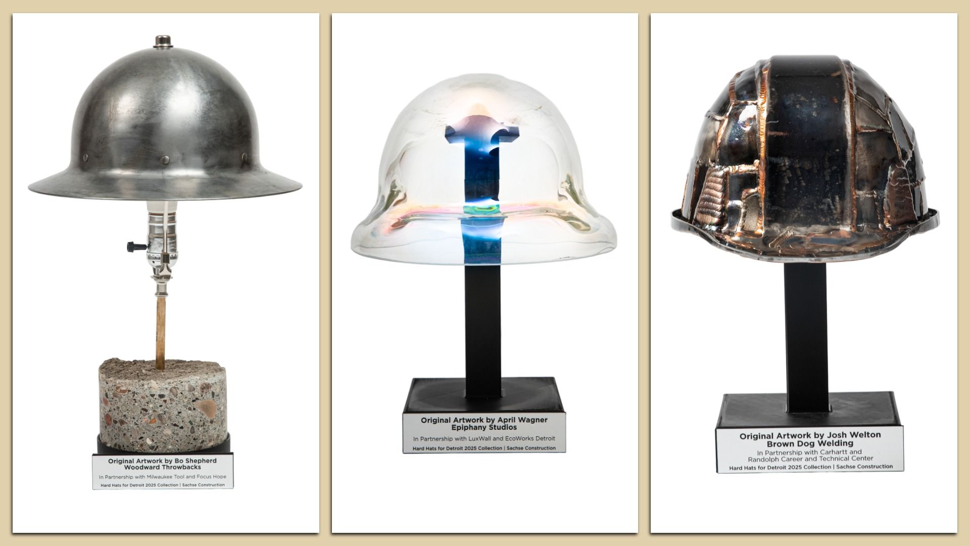 Three artistic hard hats on stands: a silver hat on concrete base, a glass helmet and a metal helmet with welding details, each with an artists' plaque