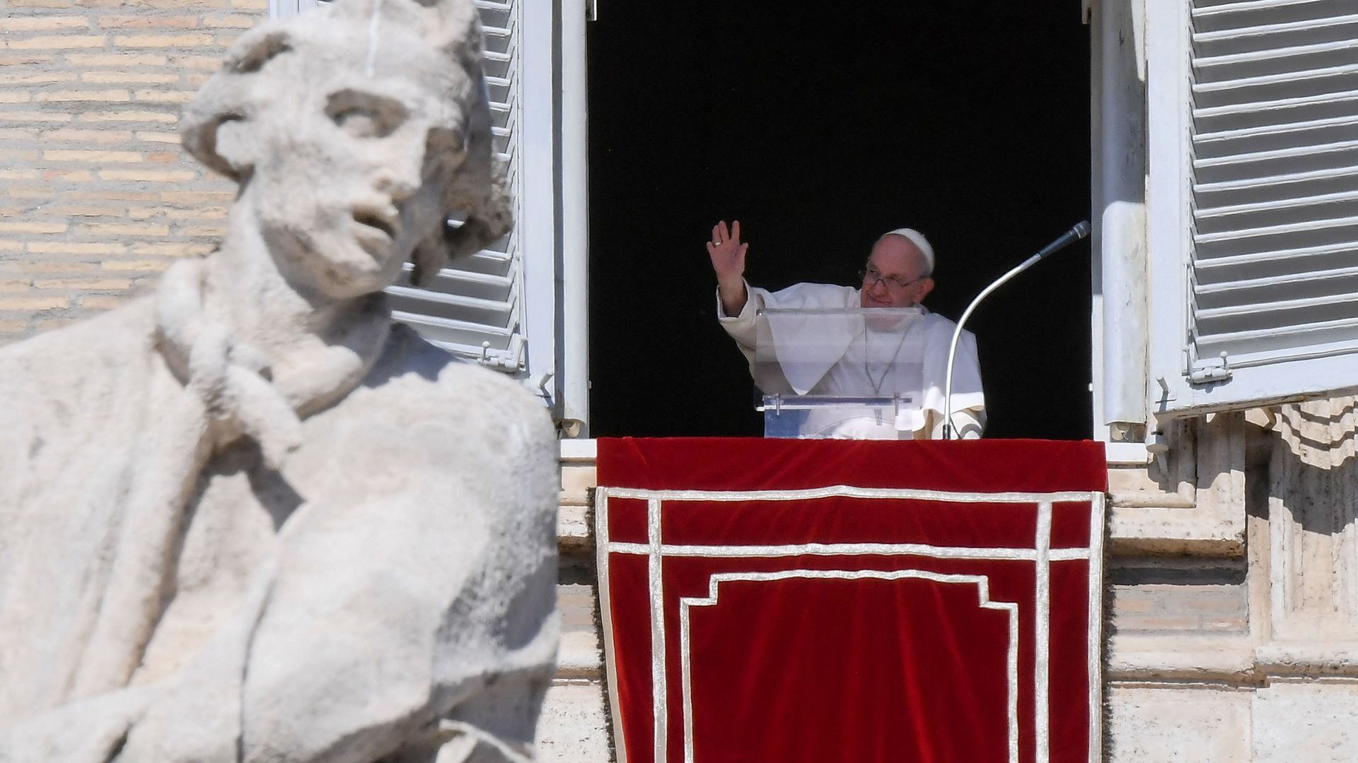 Pope Francis waving from the window of the apostolic palace in the Vatican on Oct. 16.