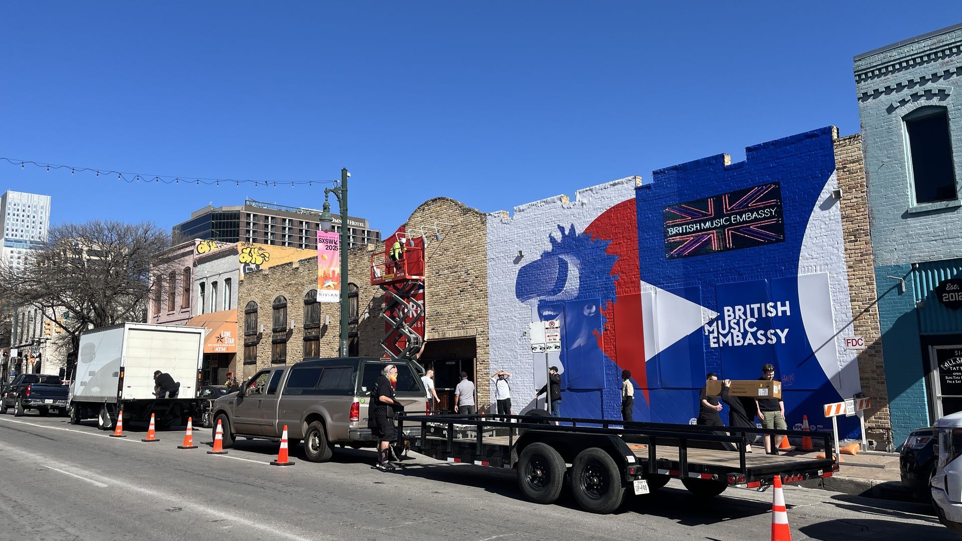 a photo of buildings in downtown austin painted for sxsw.