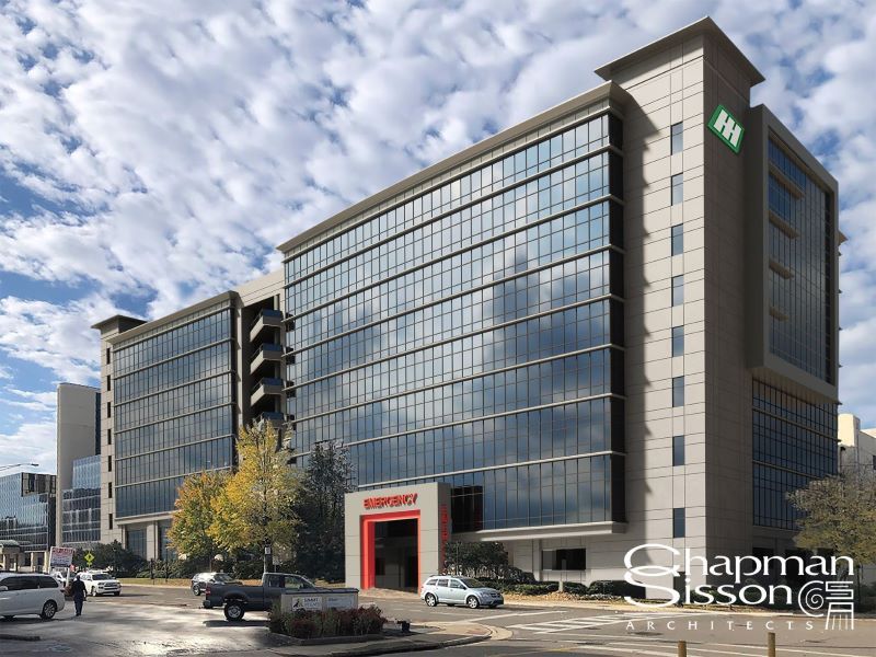 A rendering shows a completed hospital tower with emergency entrance highlighted in red. 