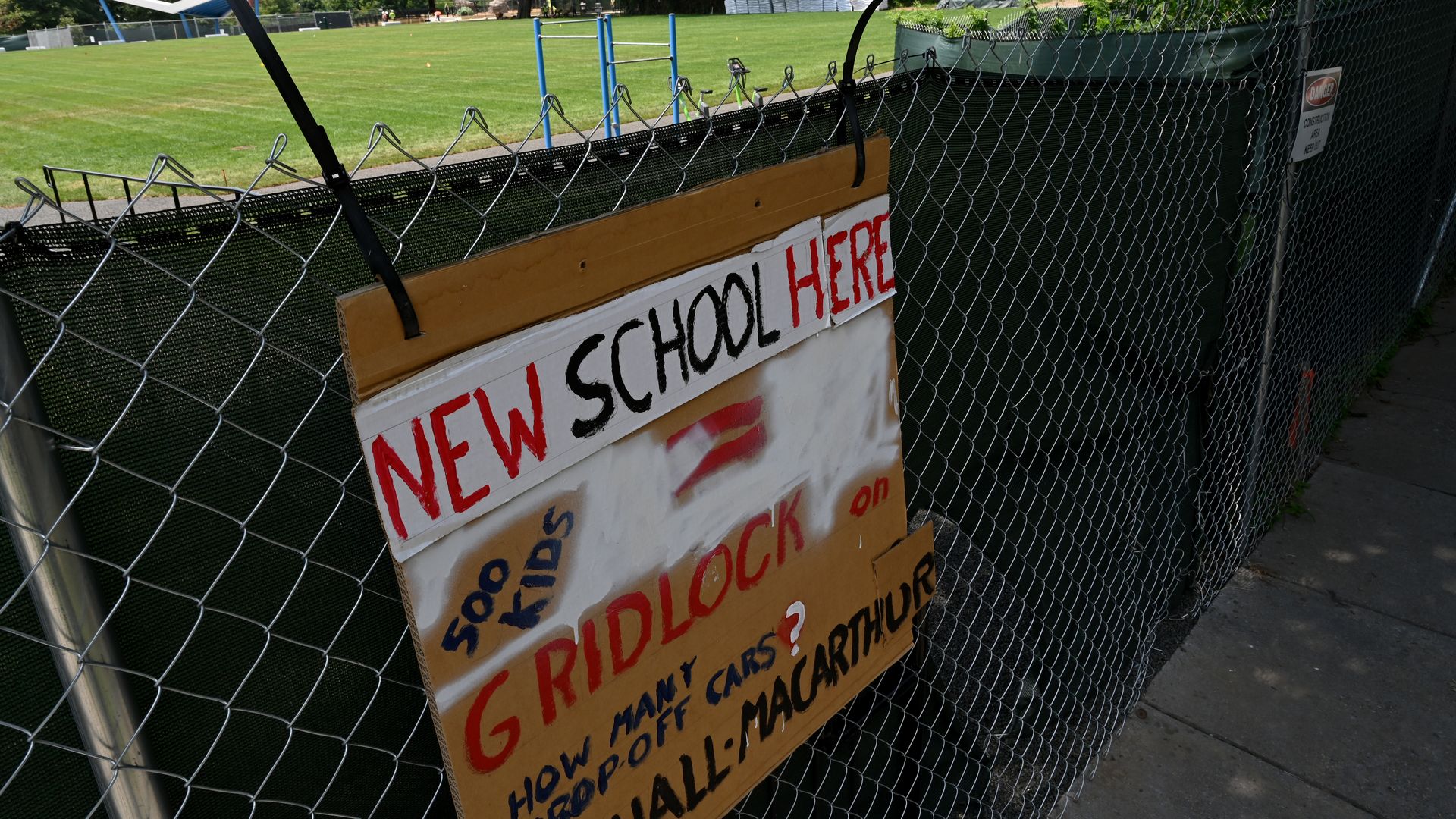 A sign opposing a new school building at Hardy Park