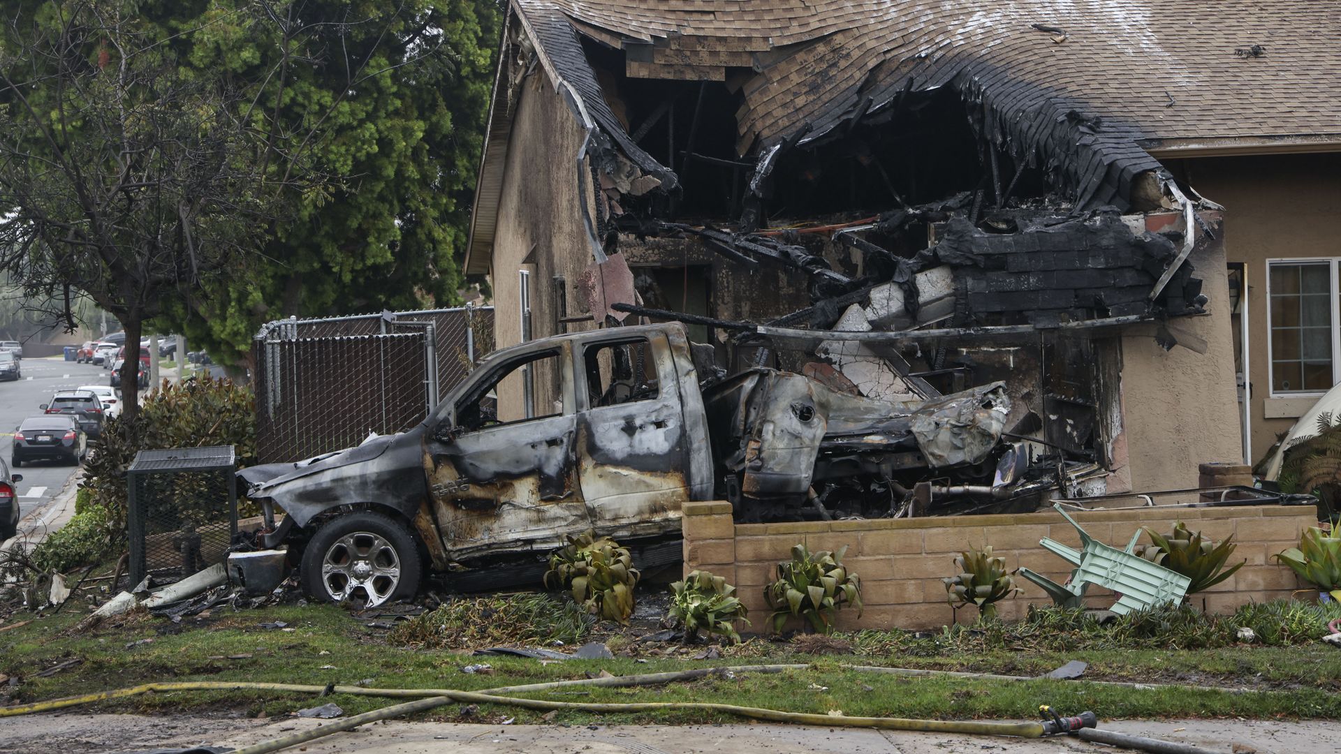  A home is partially destroyed where a small plane crashed into a San Diego, California, residential street on May 22, 2025.