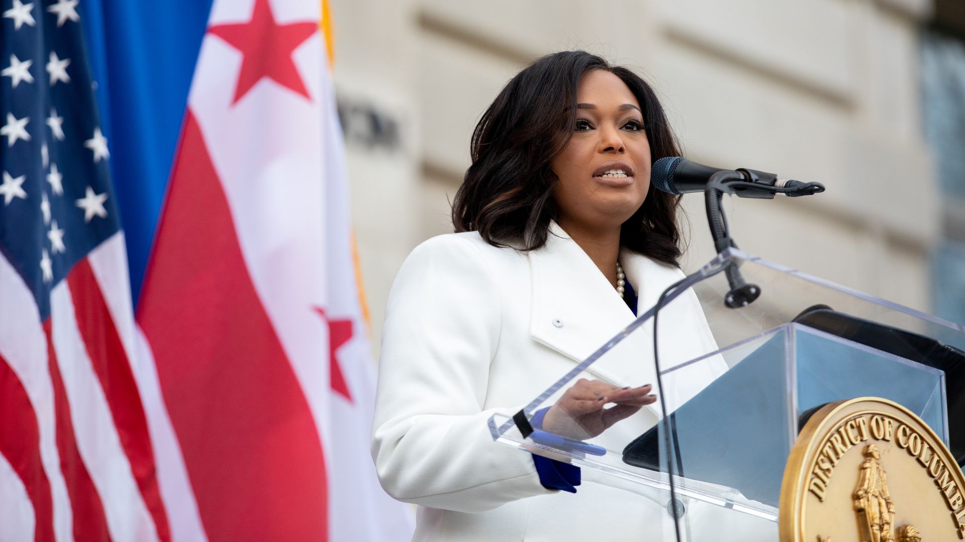 Janeese Lewis George speaks at a podium