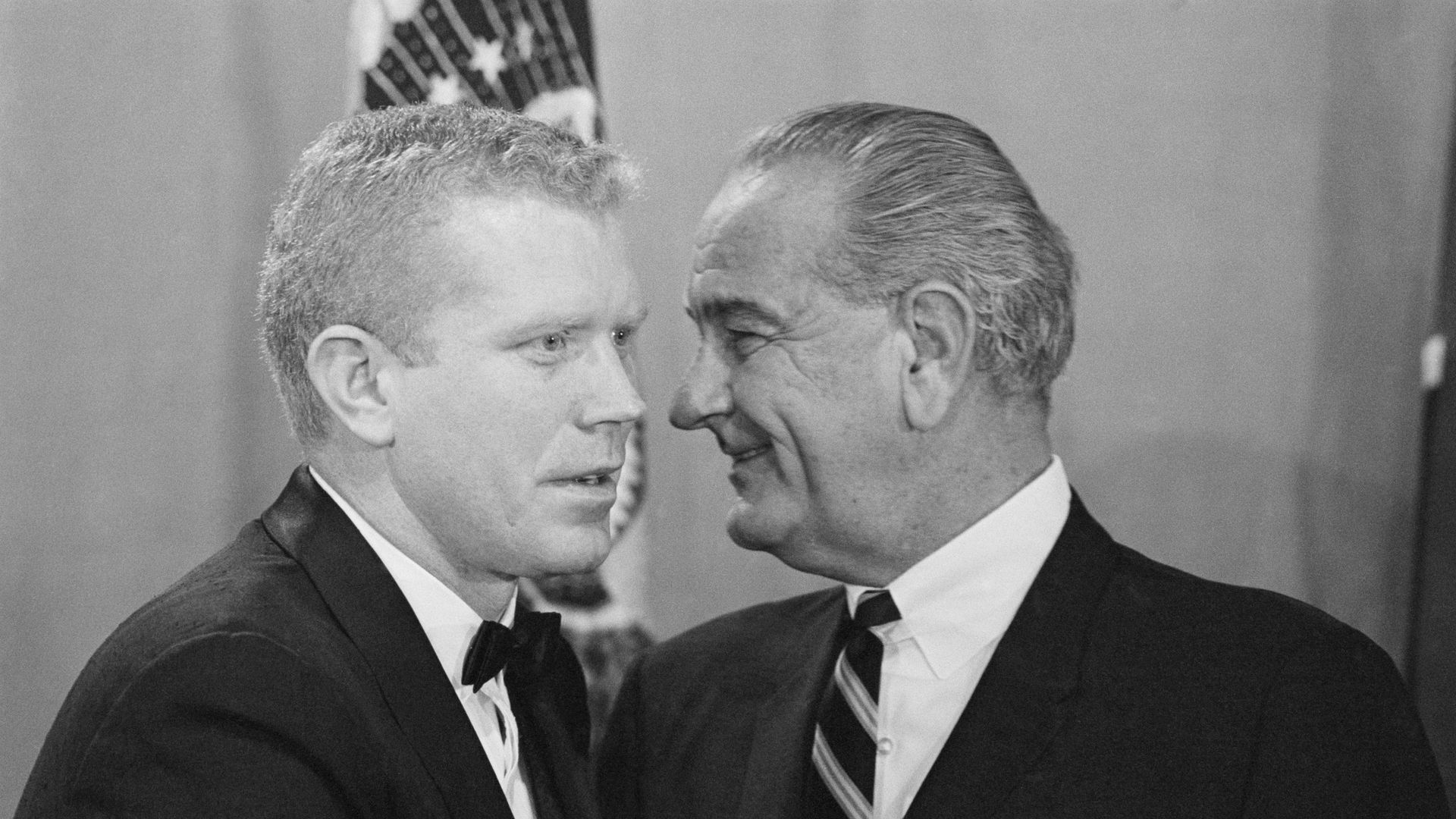 A black and white image of Ben Barnes and Lyndon Johnson talking closely