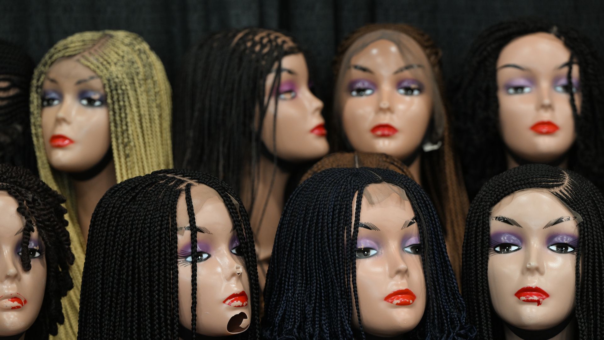 Wigs on dummies' heads.