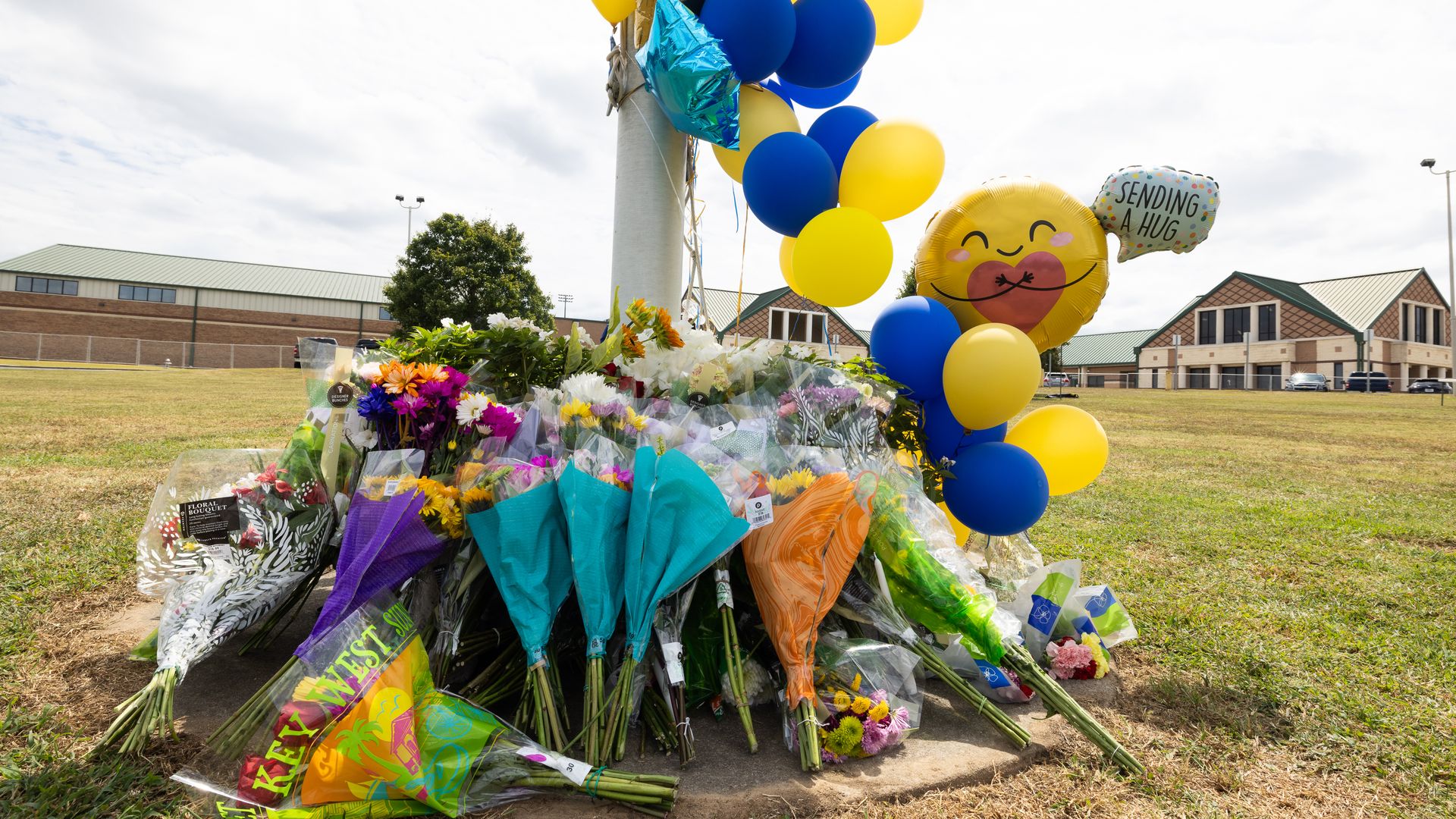 A memorial of flowers and balloons grows in front of Apalachee High School on September 5, 2024 in Winder, Georgia. Two students and two teachers were shot and killed at the school on September 4, and a 14-year-old suspect, who is a student at the school, is in custody.