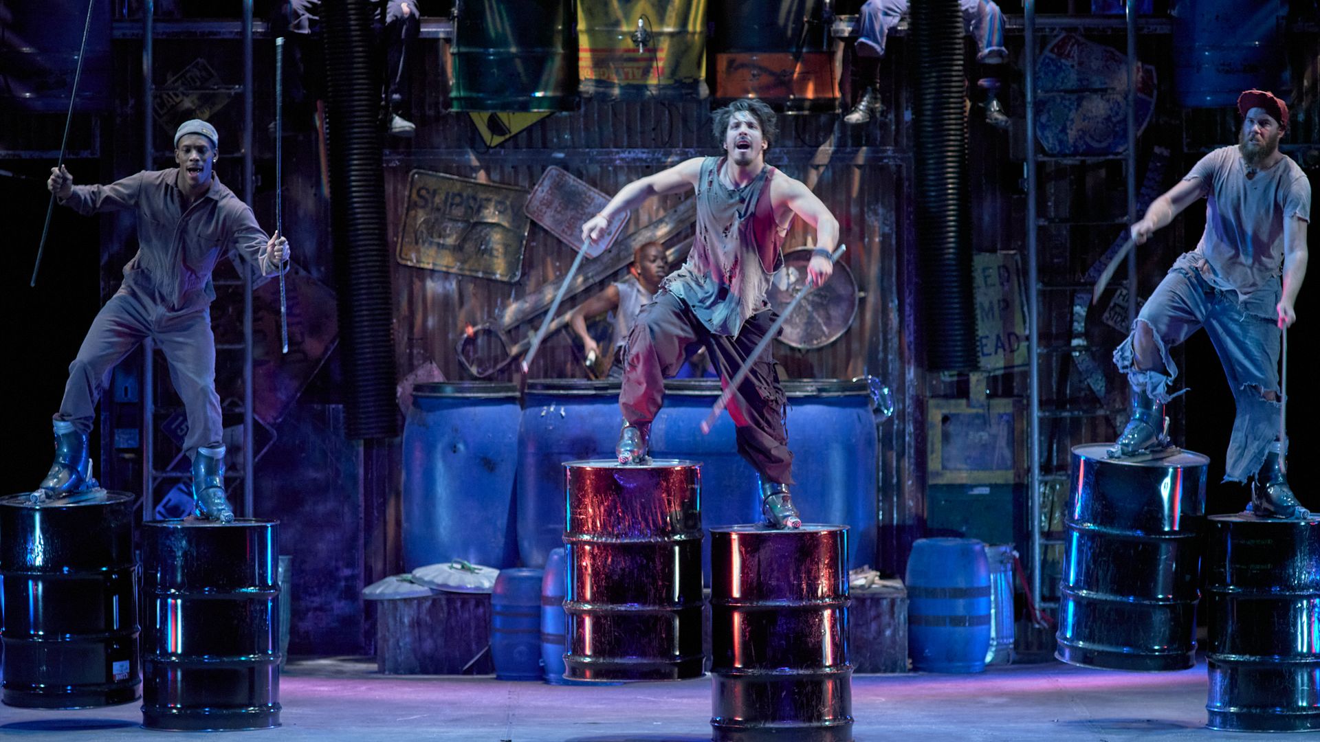 Three men in STOMP