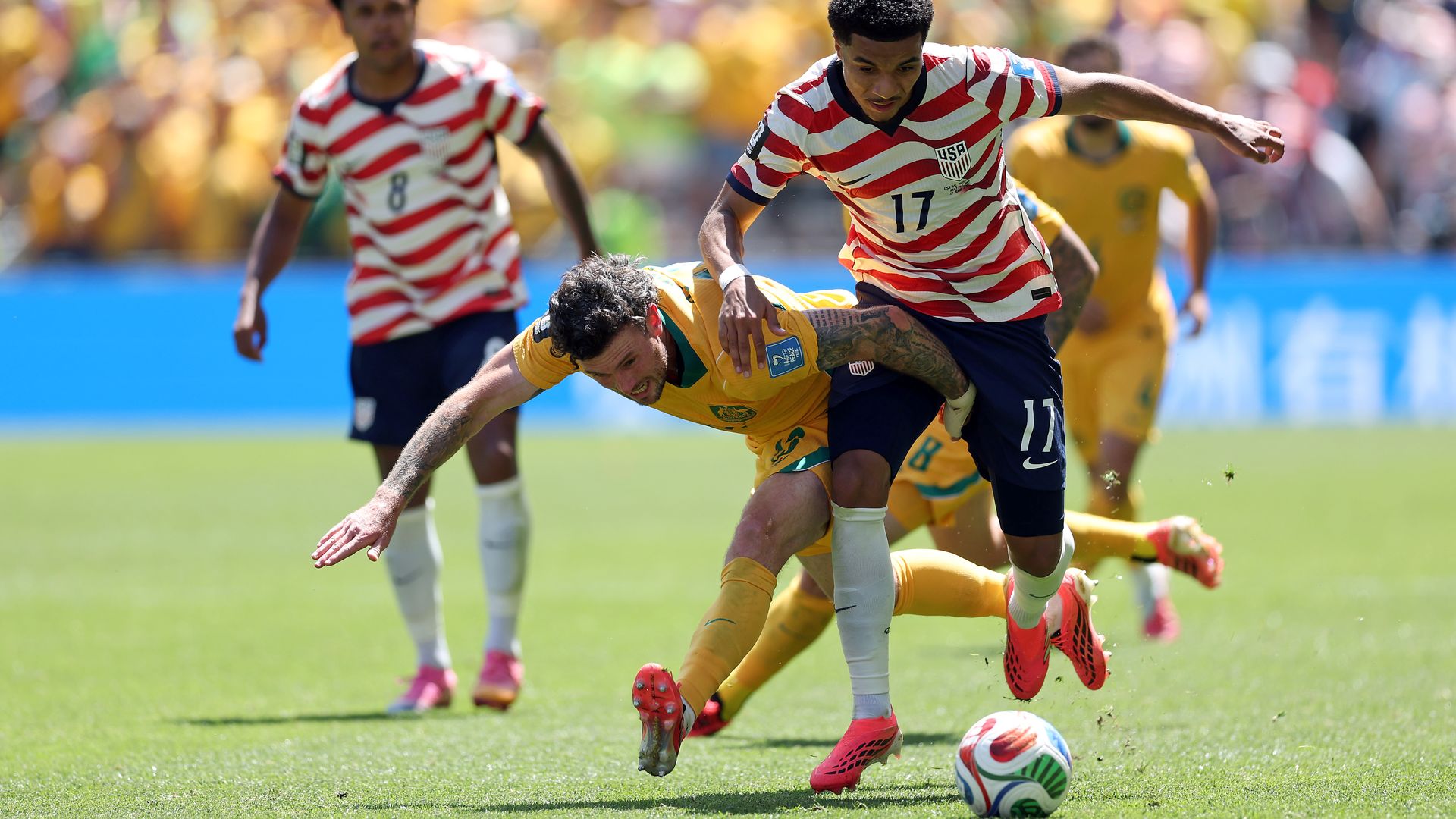 U.S. player Malik Tillman dribbles the ball against Australia in the World Cup.