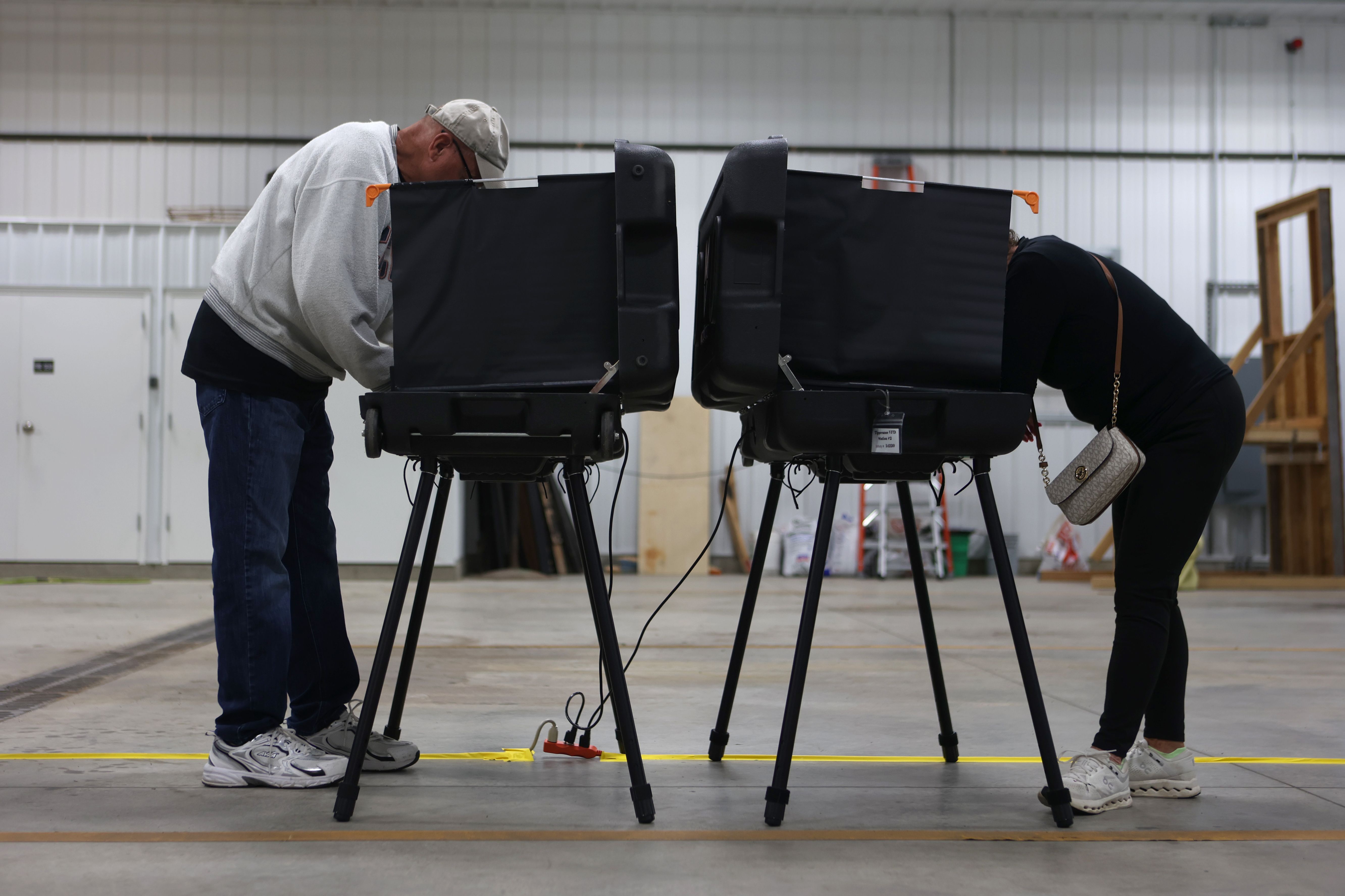 A husband and wife vote in Indiana's primary election yesterday in West Lafayette, Ind. 