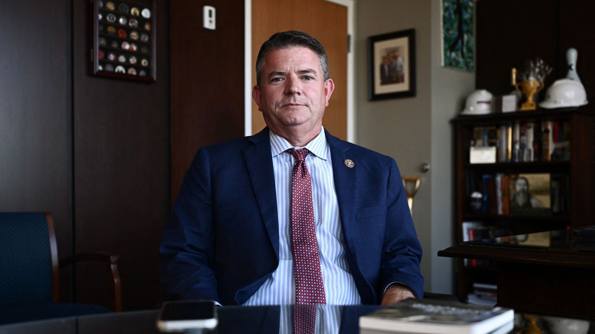 A man sitting at a desk.