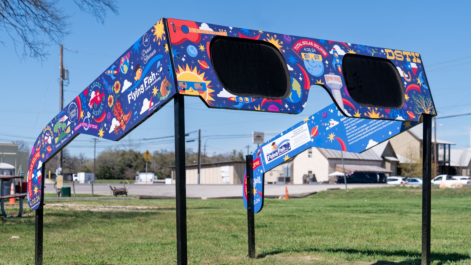Giant eclipse glasses in a field.