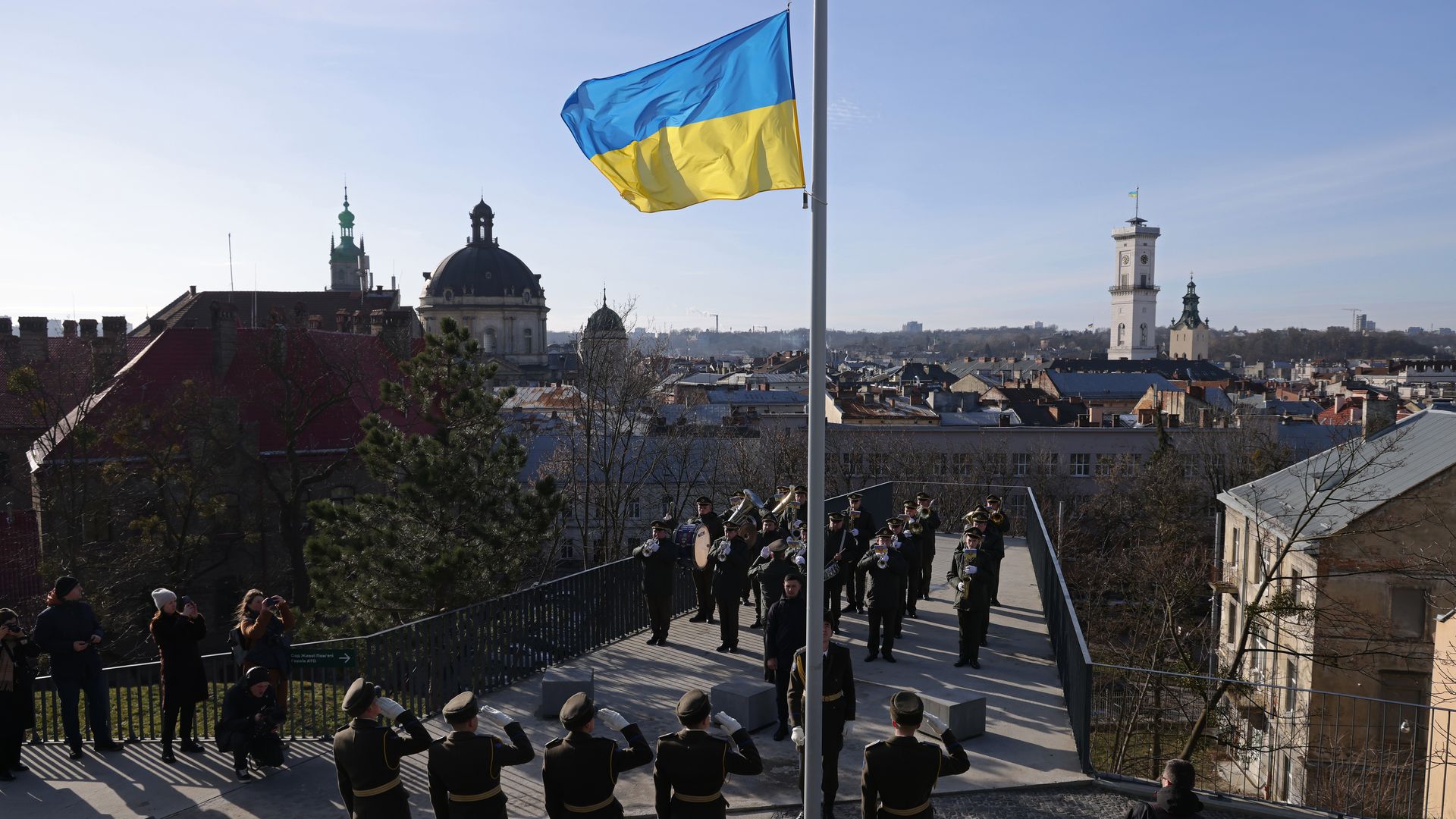  An honor guard raising the Ukrainian flag during a ceremony in Lviv, Ukraine, in February 2023.