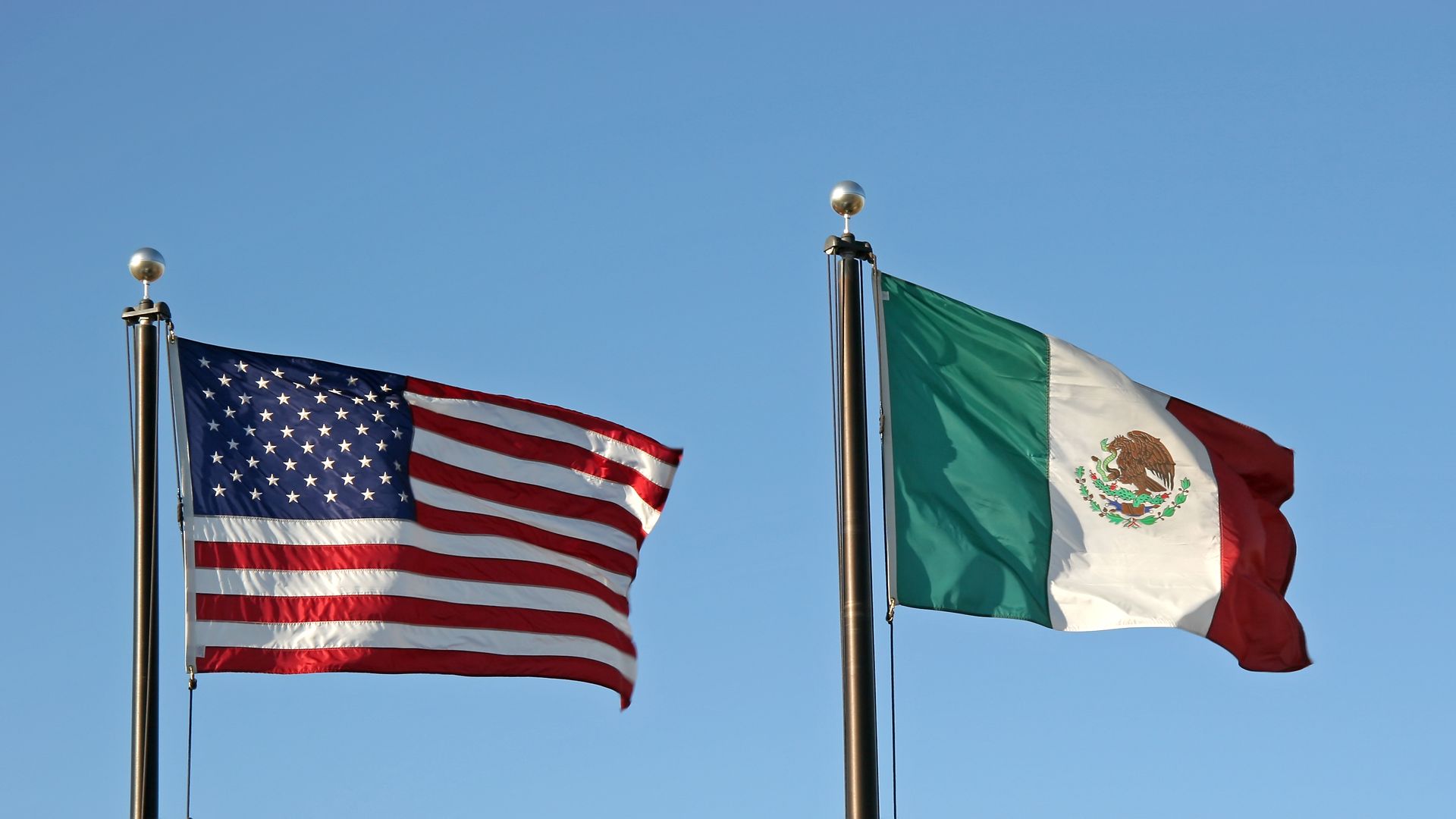 The American and Mexican flag side by side