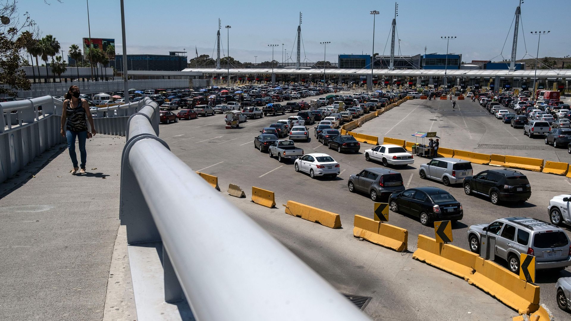 Commuters line up to cross to the United States at the San Ysidro crossing port in Tijuana, Baja California state