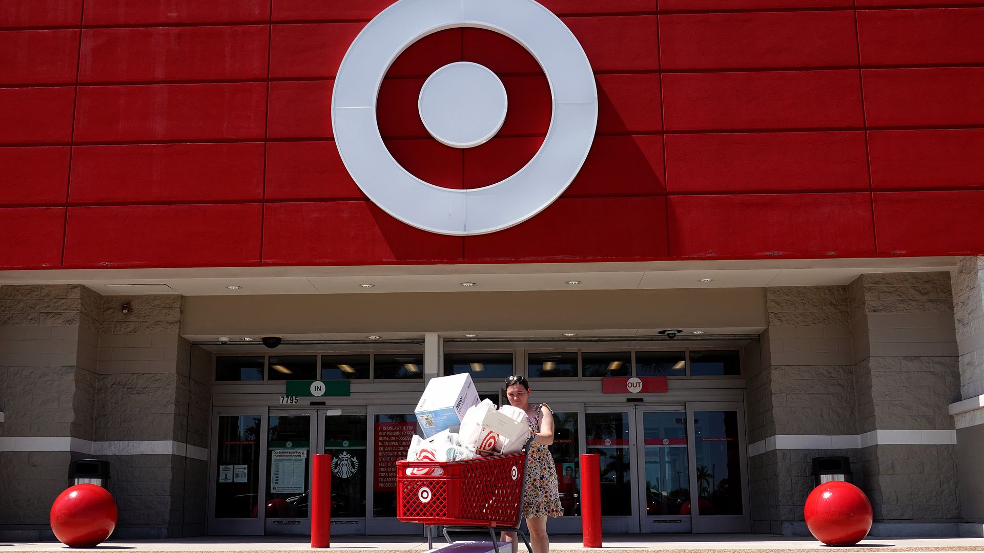 woman pushing cart out of Target