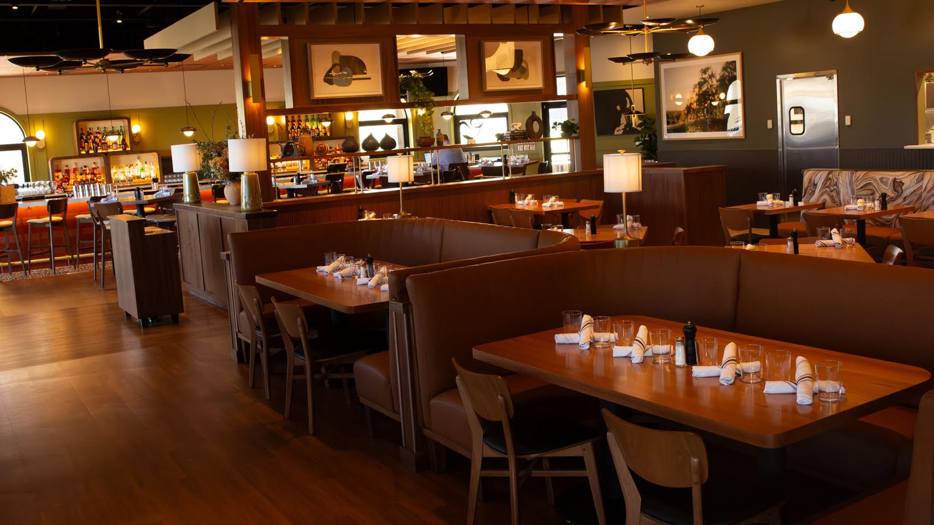 A sexy looking, moody restaurant dining room 