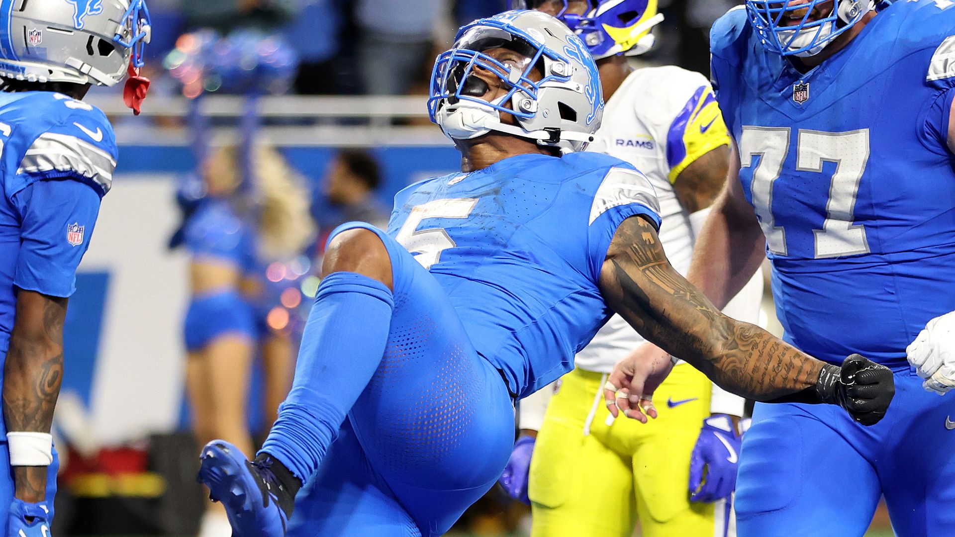 David Montgomery celebrates scoring the game-winning touchdown in overtime to beat the Los Angeles Rams. 