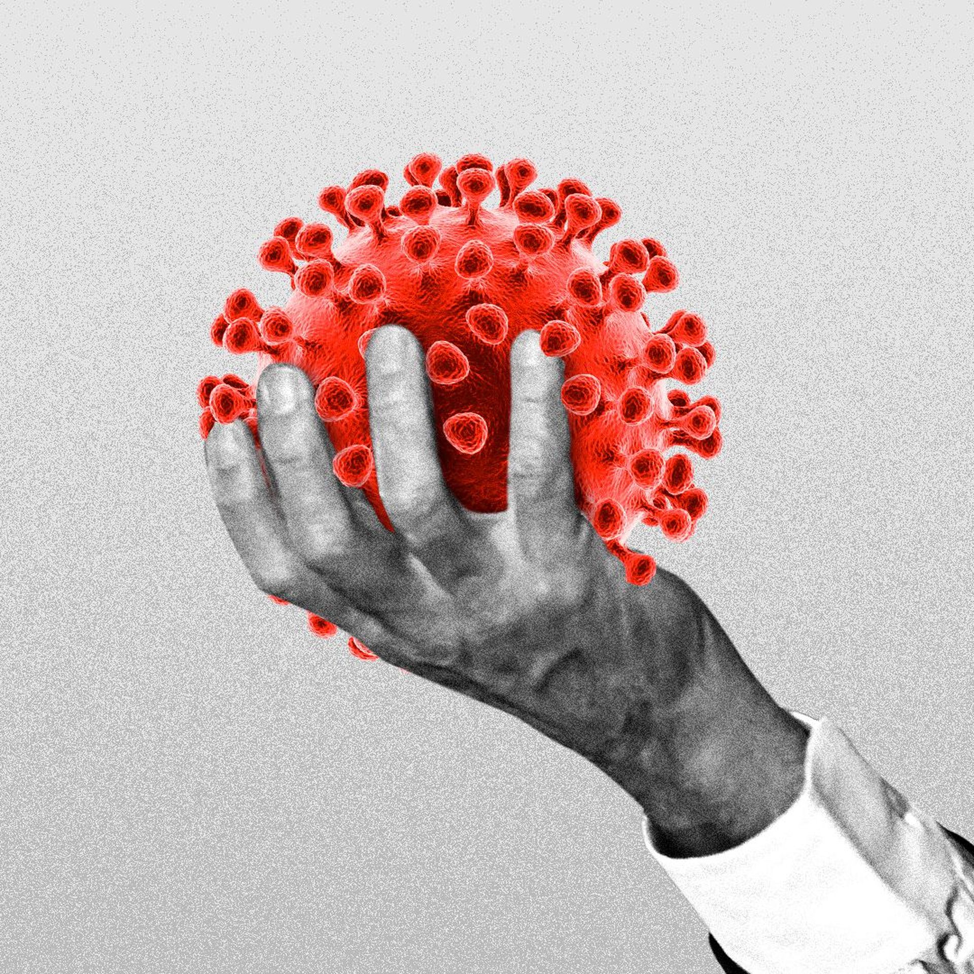Illustration of a hand holding a coronavirus cell.
