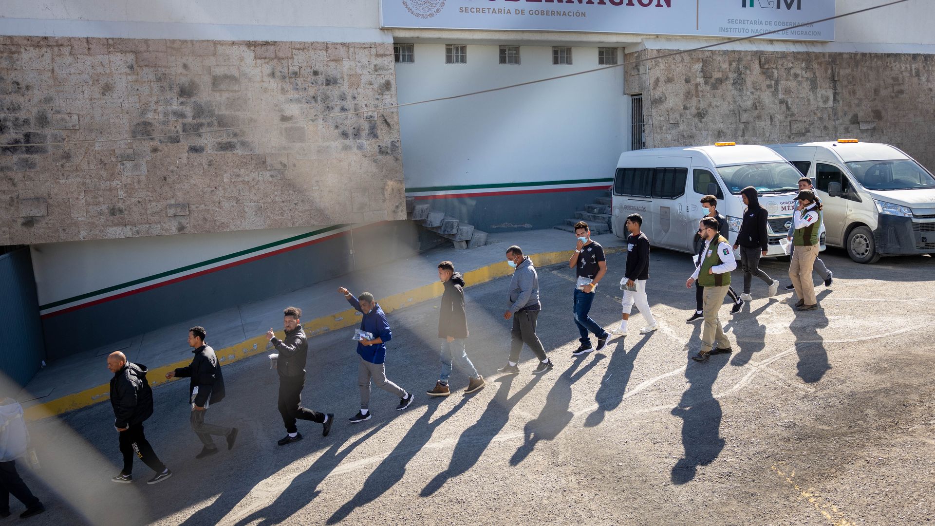 Immigrants, most from Venezuela, are escorted by Mexican immigration agents after being expelled from the United States 