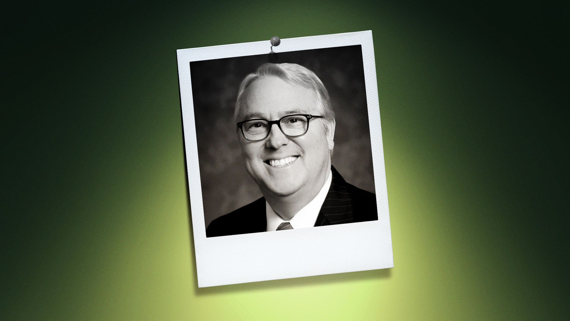 Photo illustration of Randy Woodson in the center of a Polaroid photo under a green spotlight.