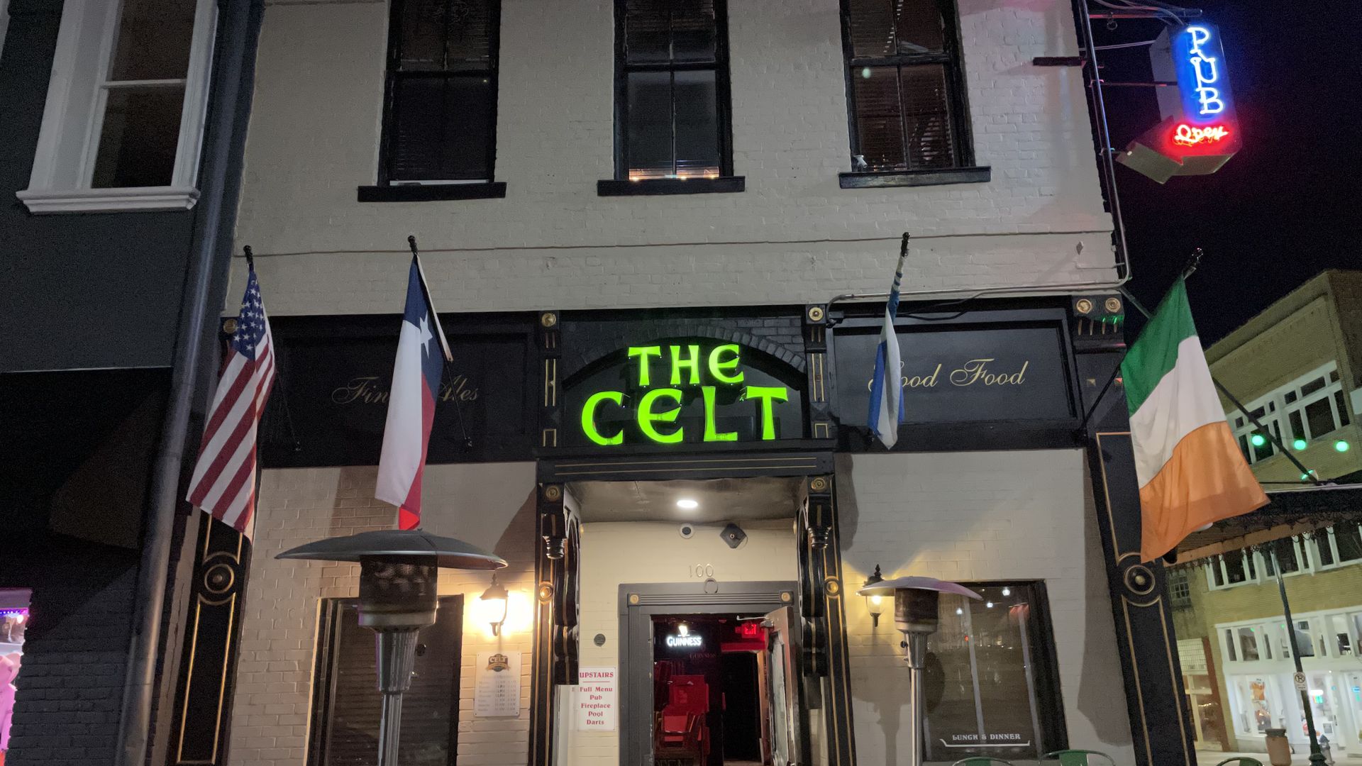 The front of a divey Irish pub