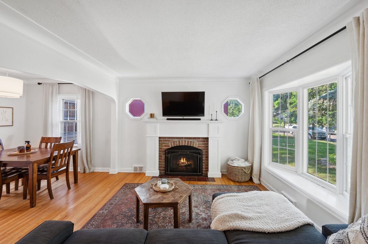 living room with open concept view of dining room