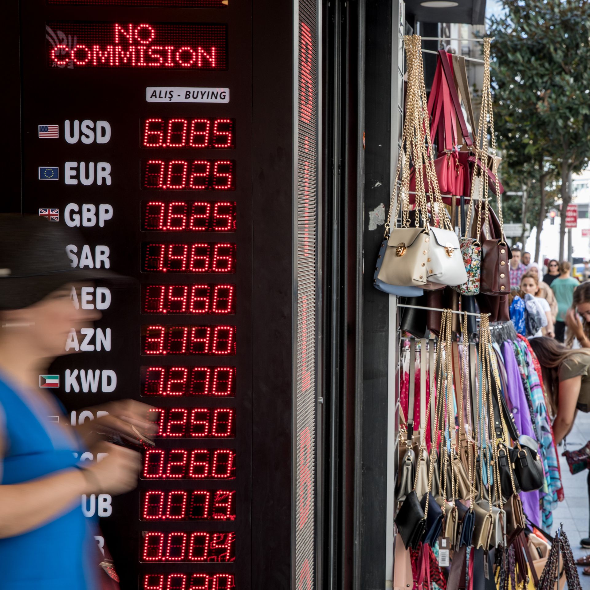 People walk past a currency exchange shop on August 14, 2018 in Istanbul, Turkey. 