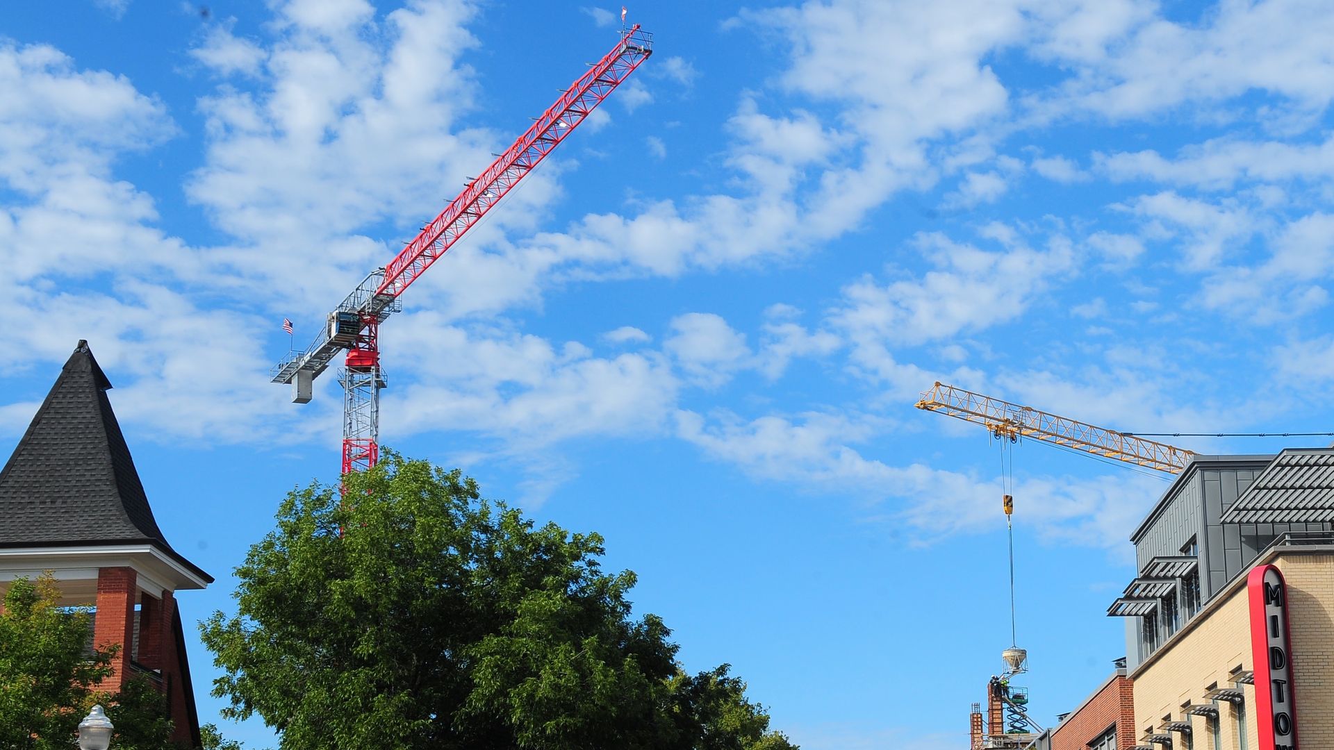 Construction cranes over downtown Bentonville. 