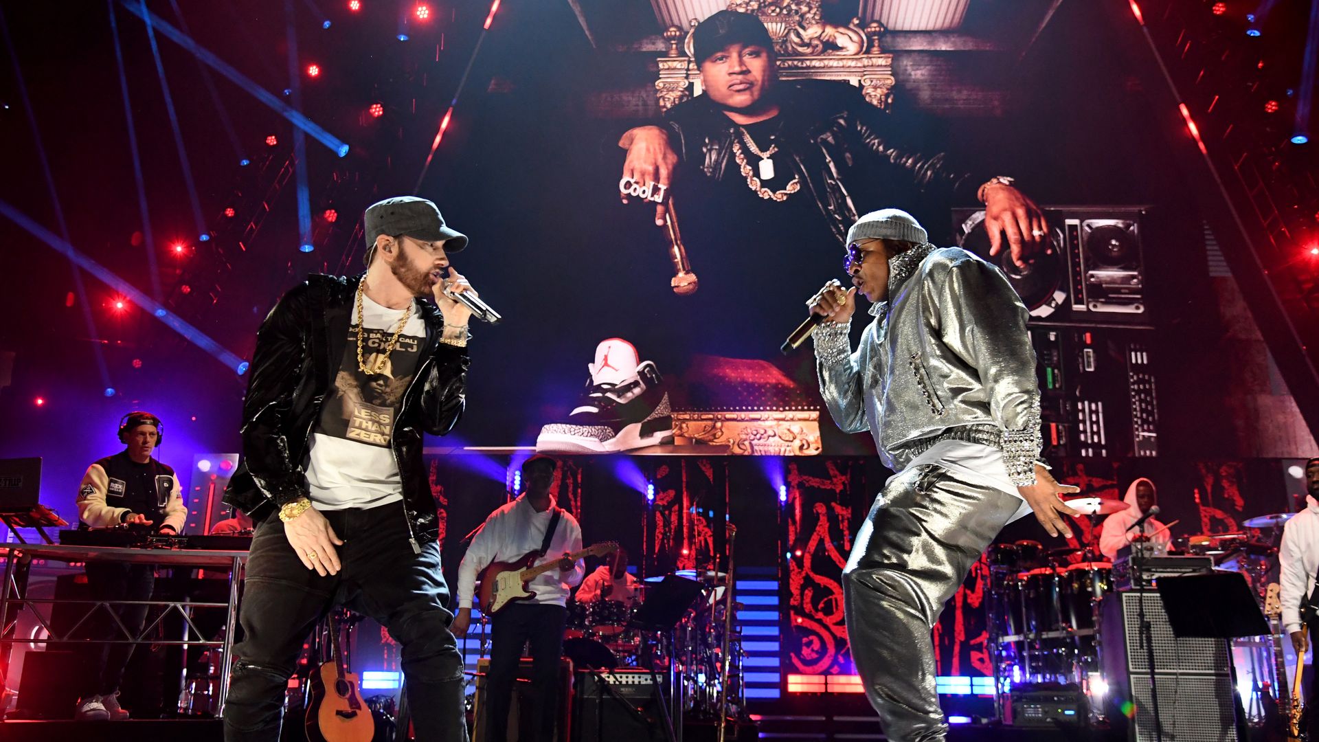 Eminem and LL Cool J perform on stage.