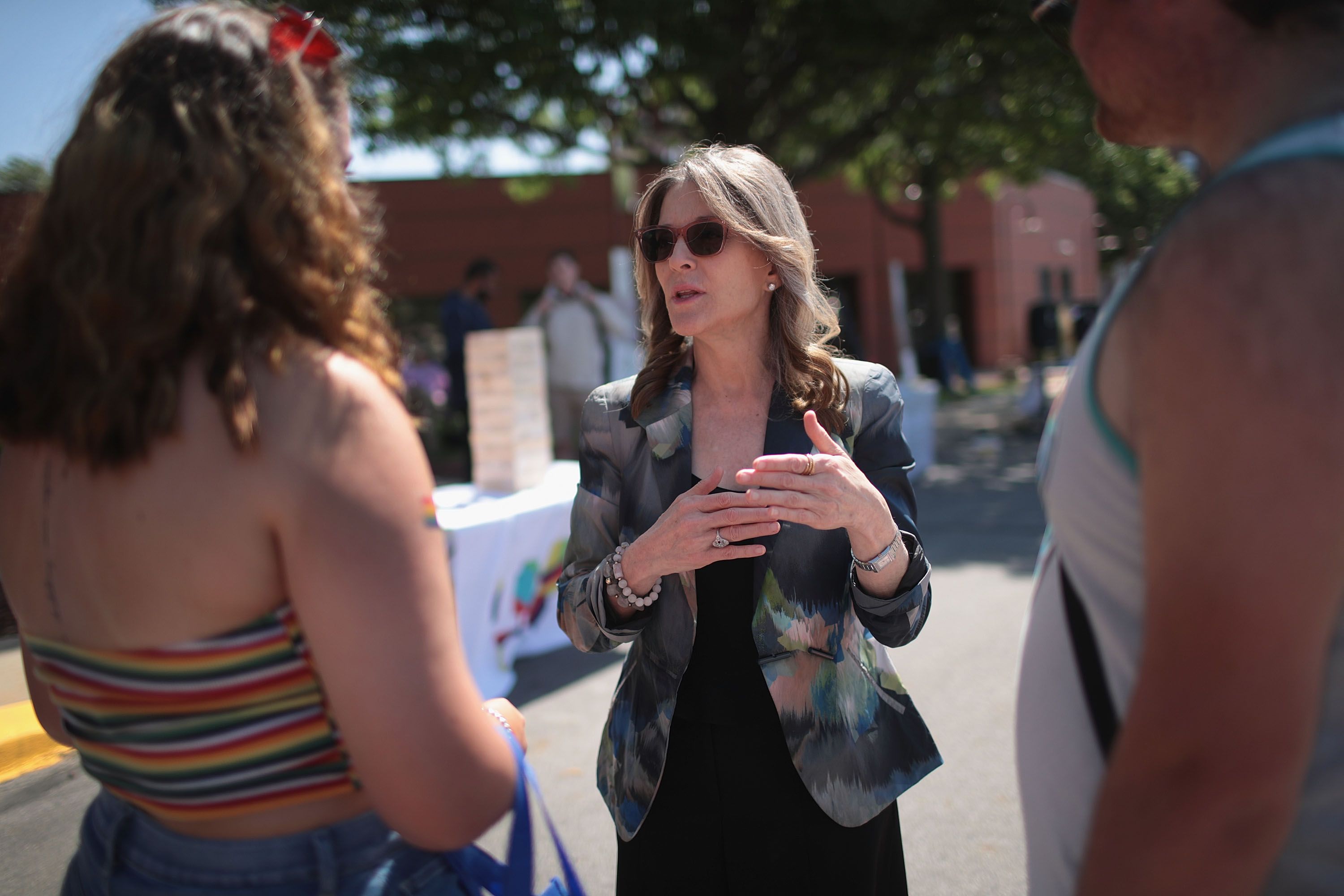 Democratic presidential candidate and self-help author Marianne Williamson greets people while campaigning at the Capital City Pride Fest on June 08, 2019 in Des Moines, Iowa. 