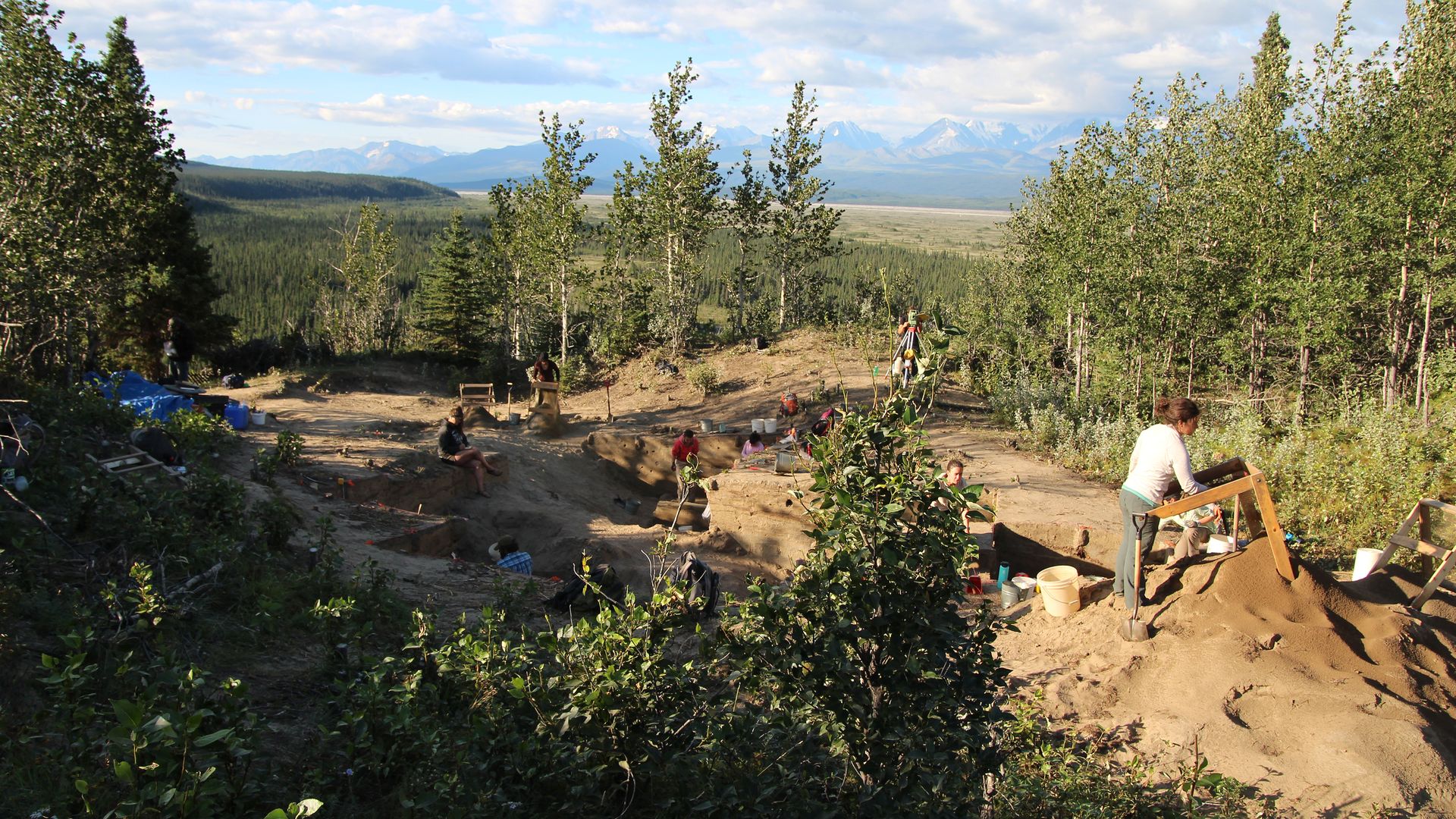 Early excavation site in Beringia with mountains in the background