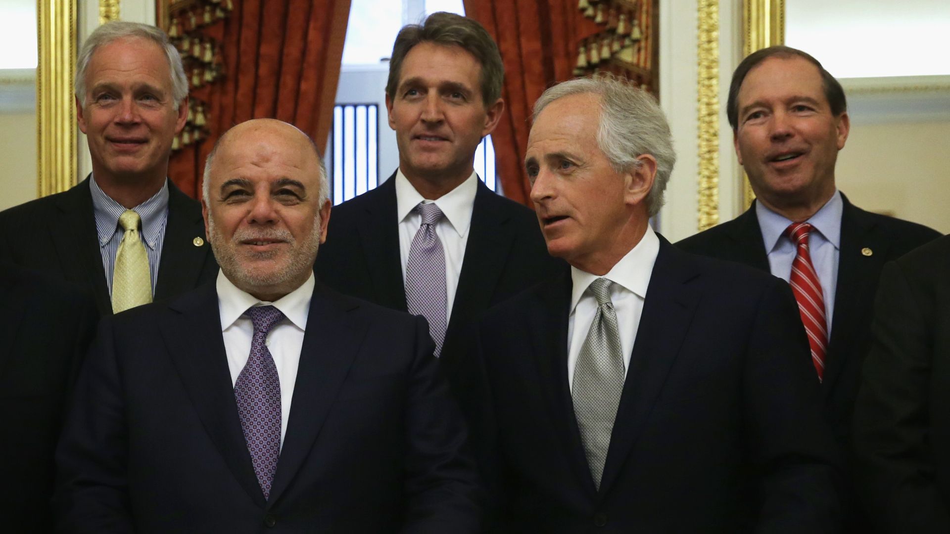 Jeff Flake and Tom Udall are seen with some of their former Senate colleagues in 2015.