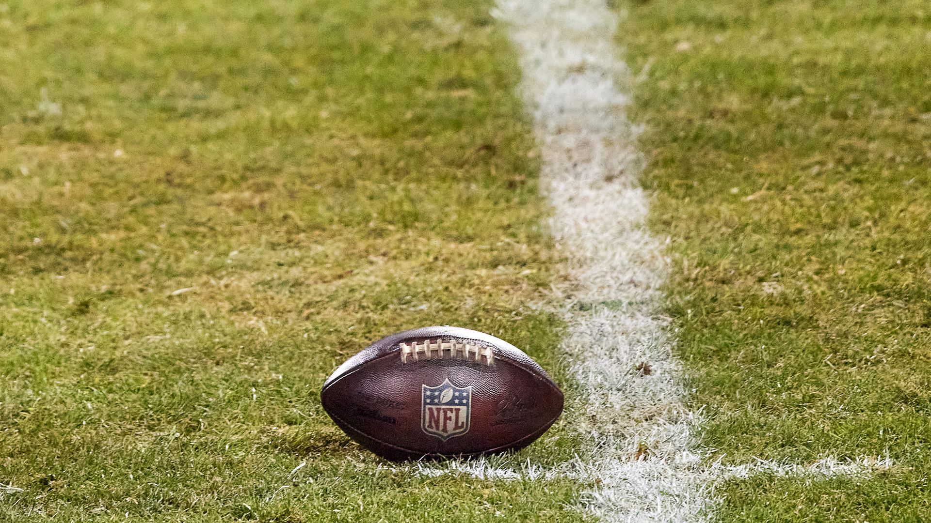 An NFL football on a field.