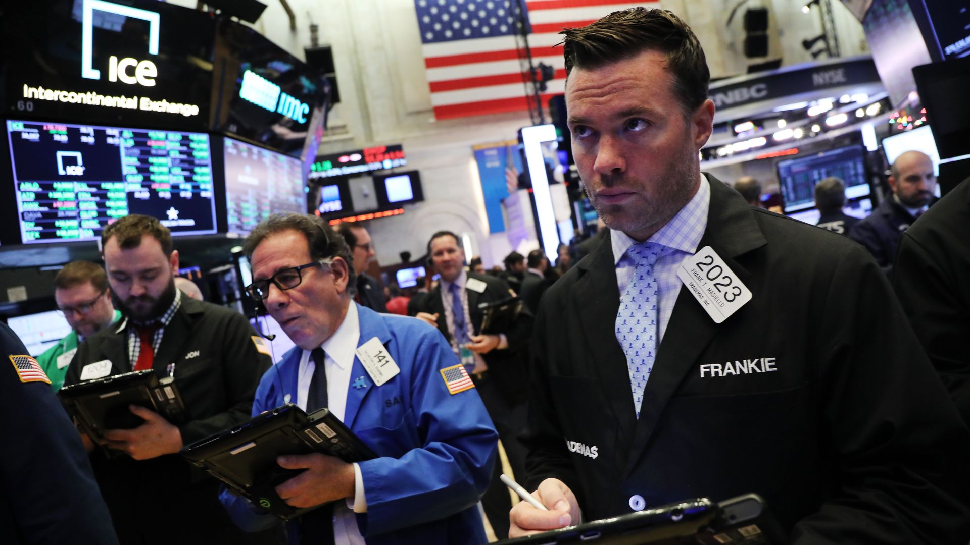 Brokers on the stock market trade floor