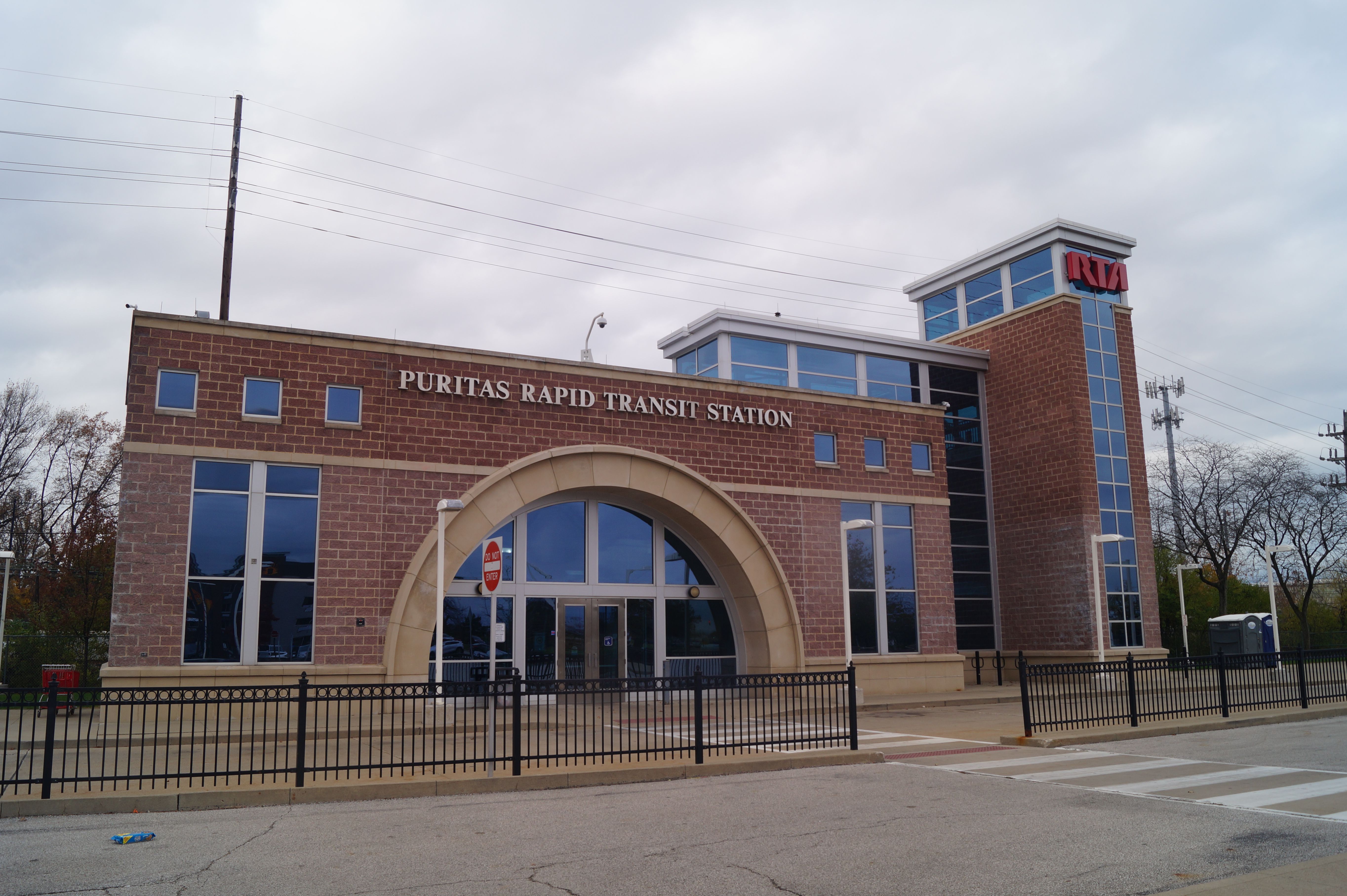 A red brick Cleveland RTA rapid transit station with an arched entryway 