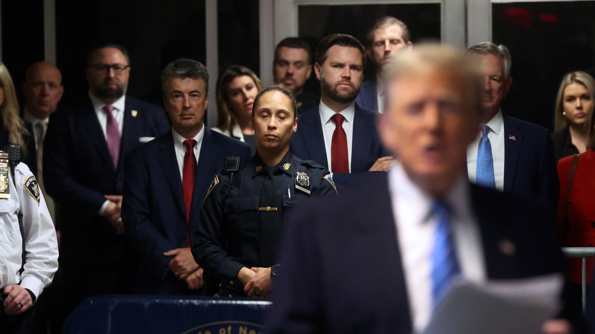 Senator J.D. Vance (R-OH) looks on as former U.S. President Donald Trump speaks to the media at his trial for allegedly covering up hush money payments at Manhattan Criminal Court on May 13, 2024 in New York City.