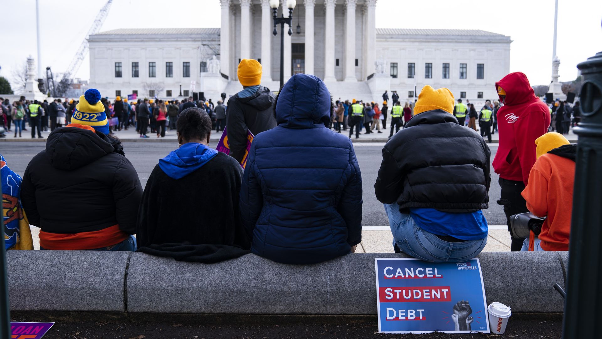 People gather during a protest in support of student debt cancellation as the Supreme Court begins oral arguments outside of the Supreme Court of the United States in Washington, D.C., on Tuesday February 28, 2023