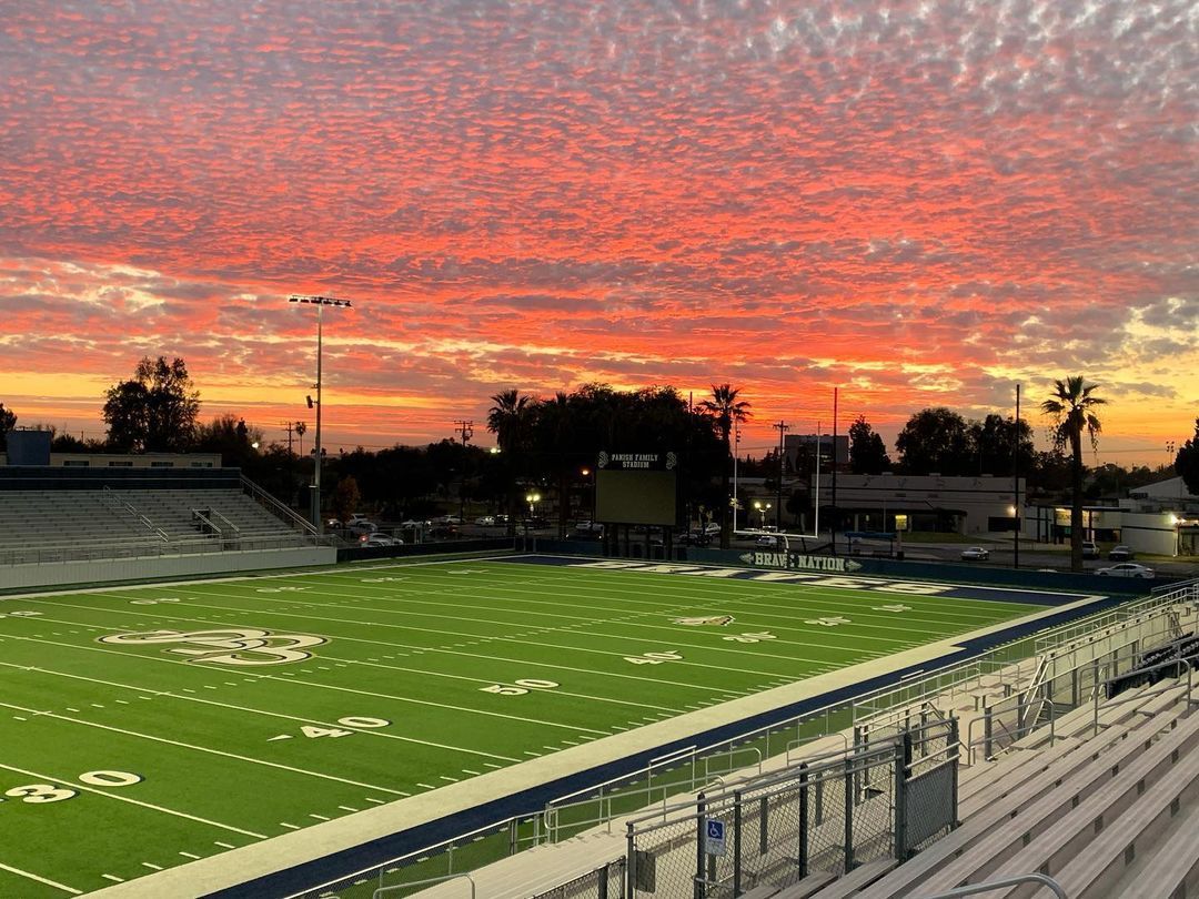 high school stadium at sunset