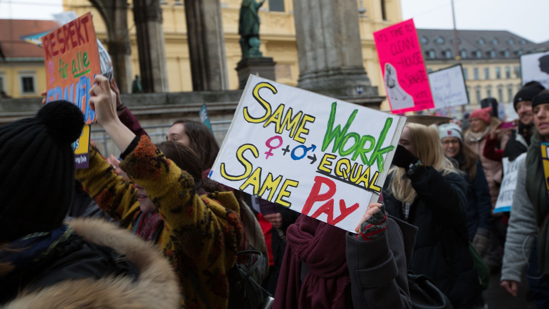 Woman hold a banner for equal pay 