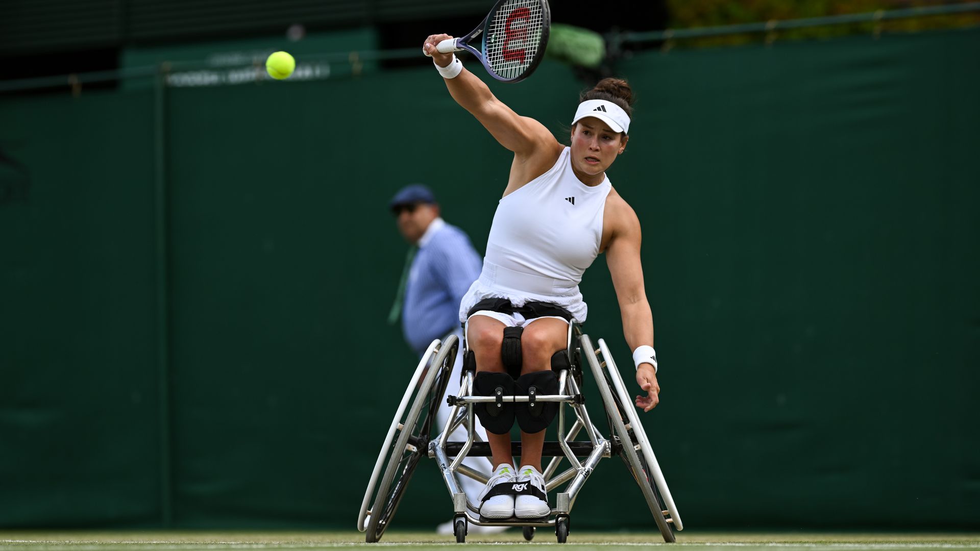 Wheelchair tennis player Dana Matthewson in action  on the court at Wimbledon.