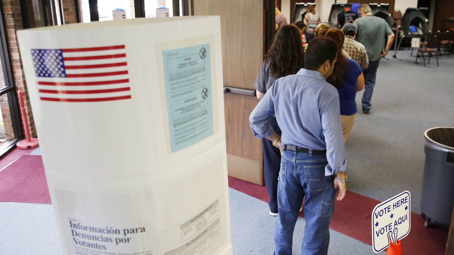 Voters stand in line to cast their ballots inside Calvary Baptist Church March 1, 2016 in Rosenberg, Texas.