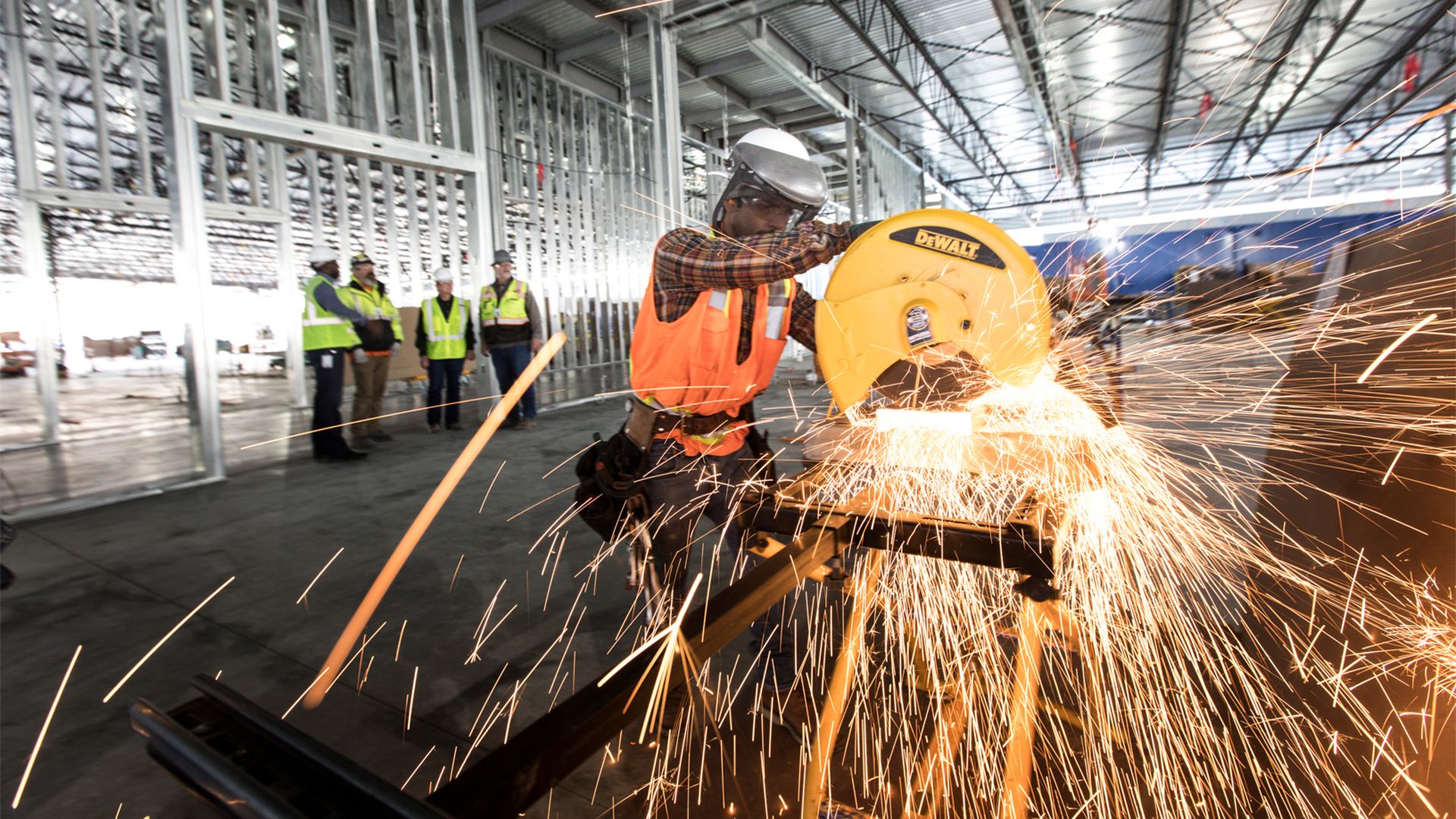 A sheet metal fabricator saw-cuts material for Apple’s data center expansion in Reno, Nevada.