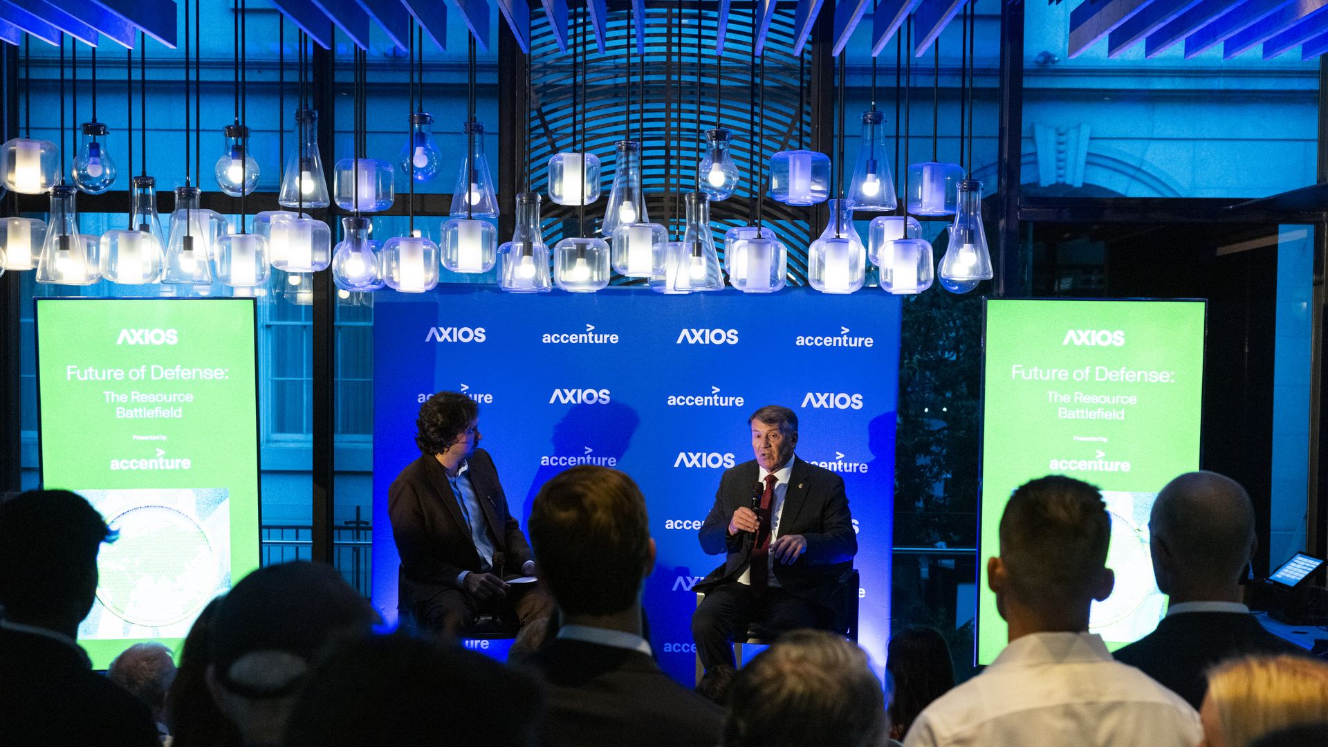 Axios' Colin Demarest on stage in conversation with Sen. Rounds.