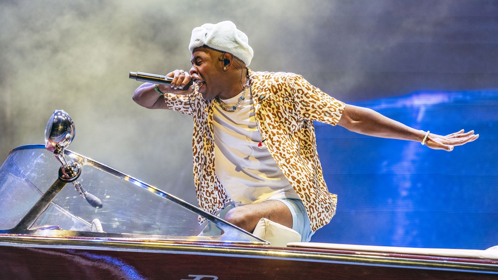 Photo of a man performing on stage 