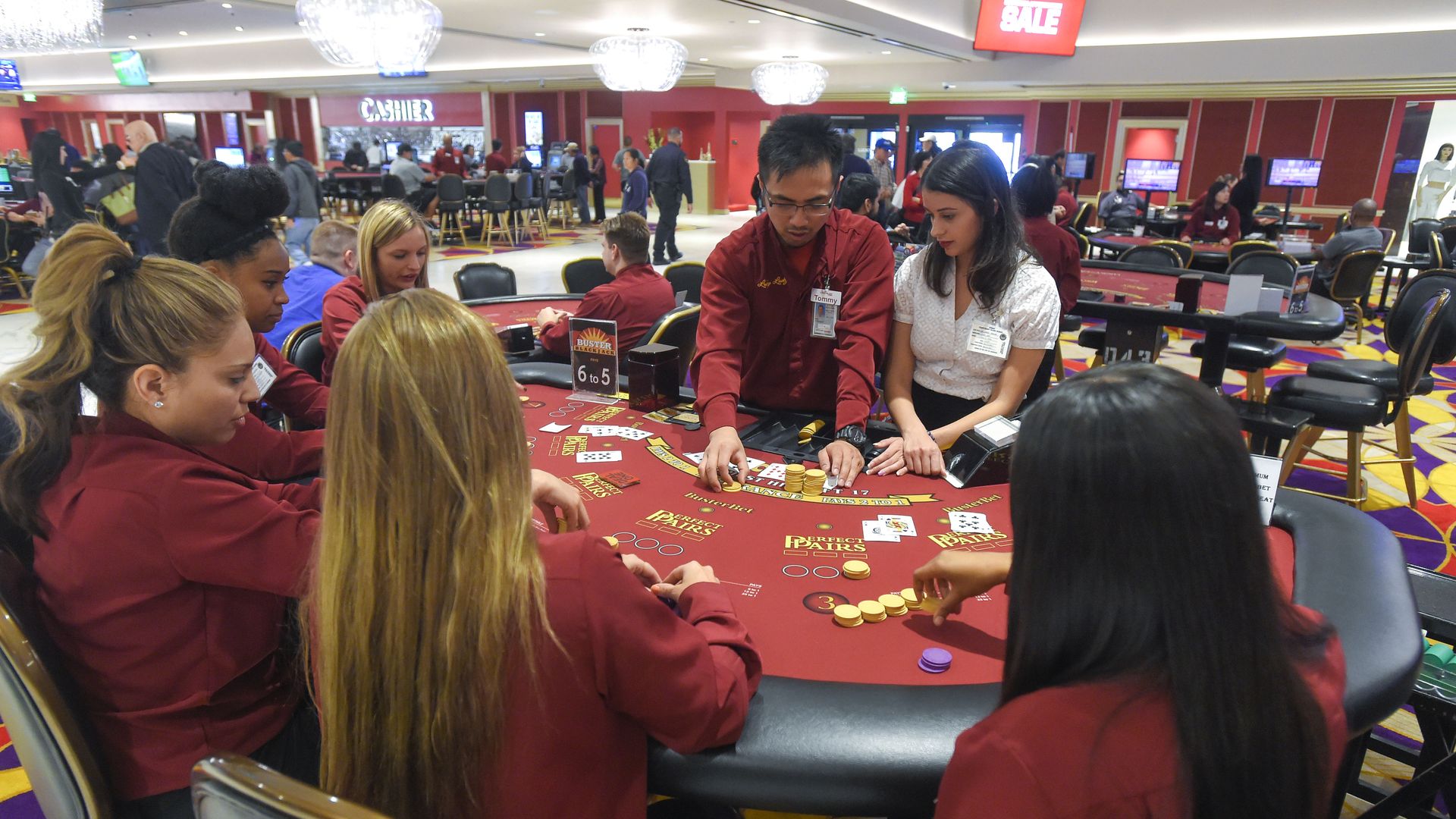Tommy Wu and Jill Diaz train newly hired black jack dealers at Larry Flynt's Lucky Lady Casino in Gardena, Calif. on March 16, 2017.