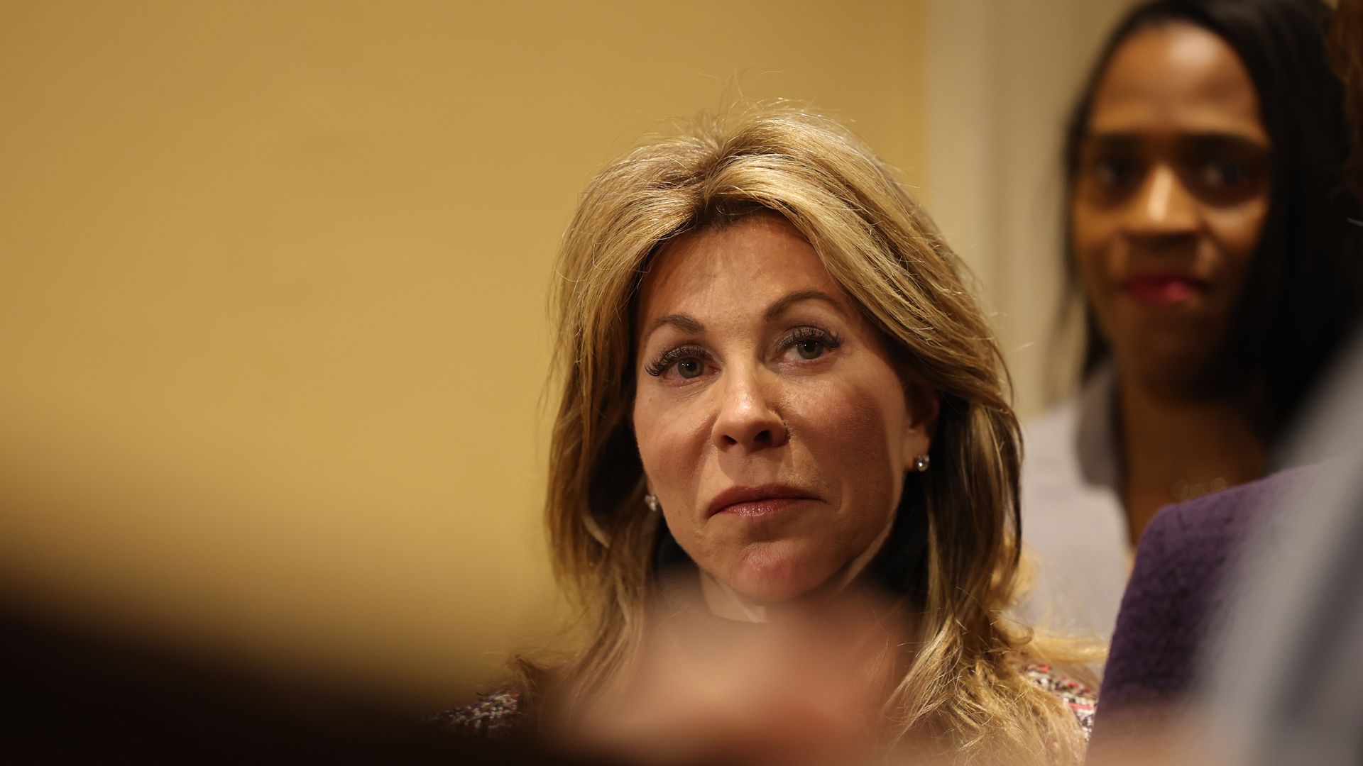 A photo of Gina Fiandaca's head as she's in a press conference in January after being named Healey's next transportation secretary
